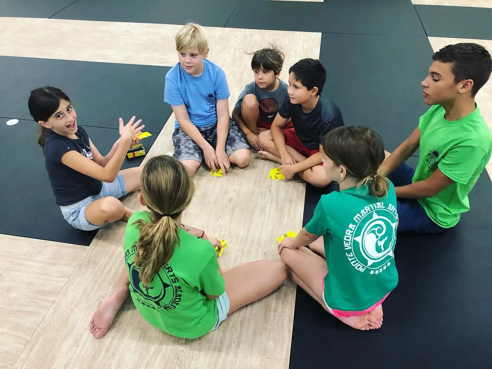 a group of people sitting on the ground