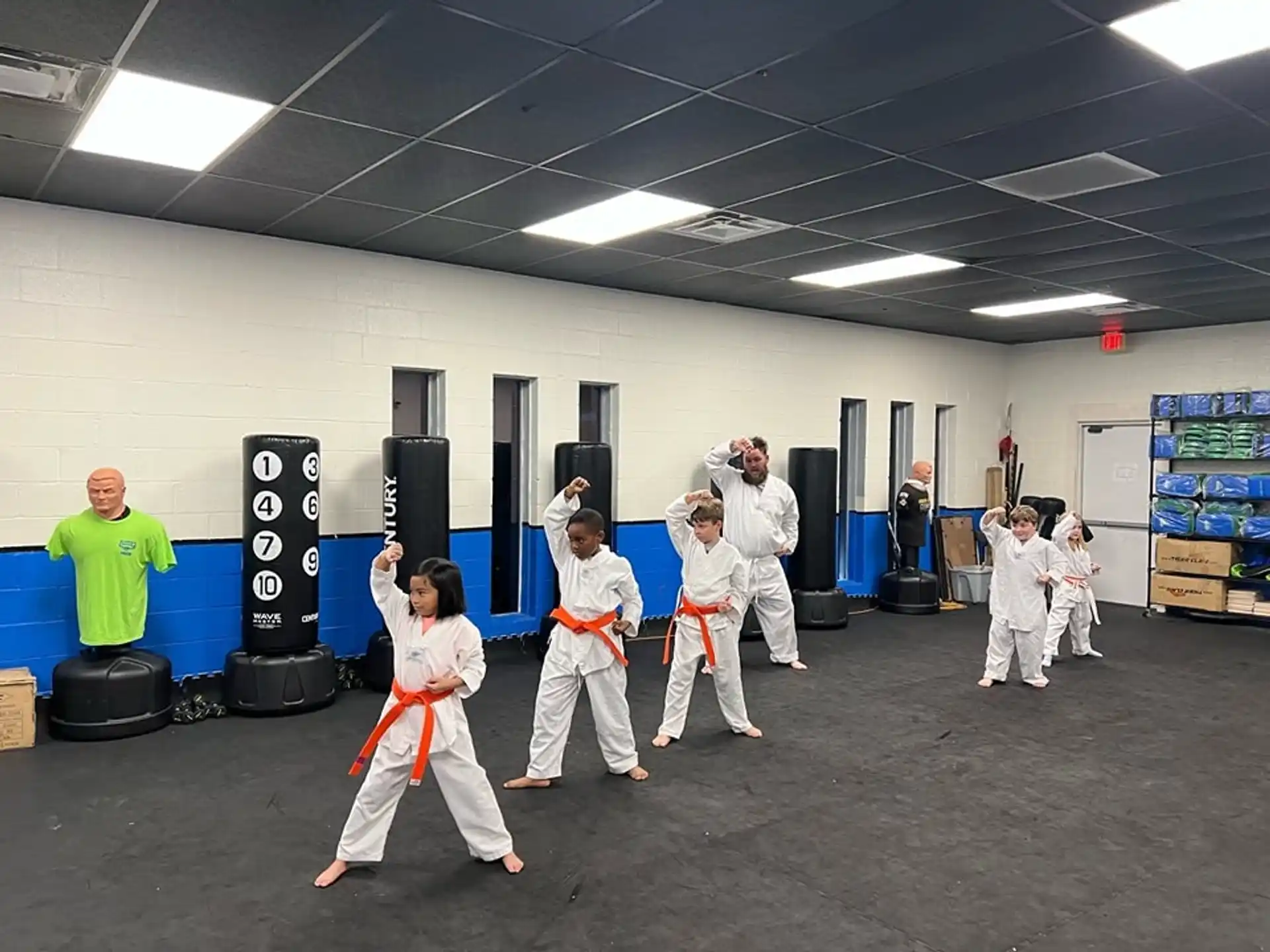 a group of people in karate uniforms