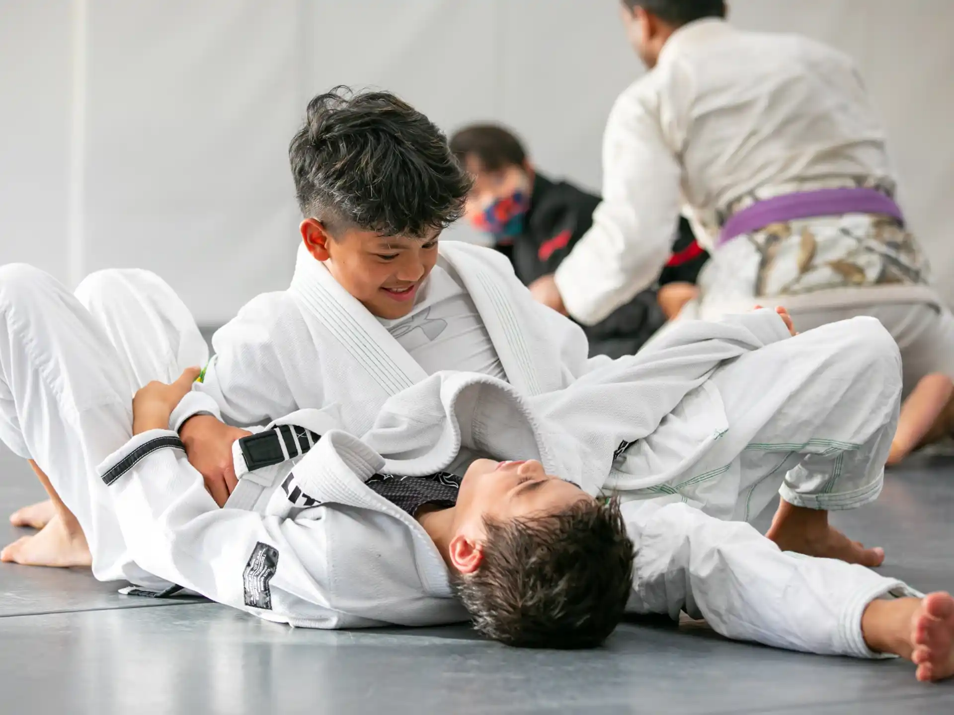 a group of people in karate uniforms