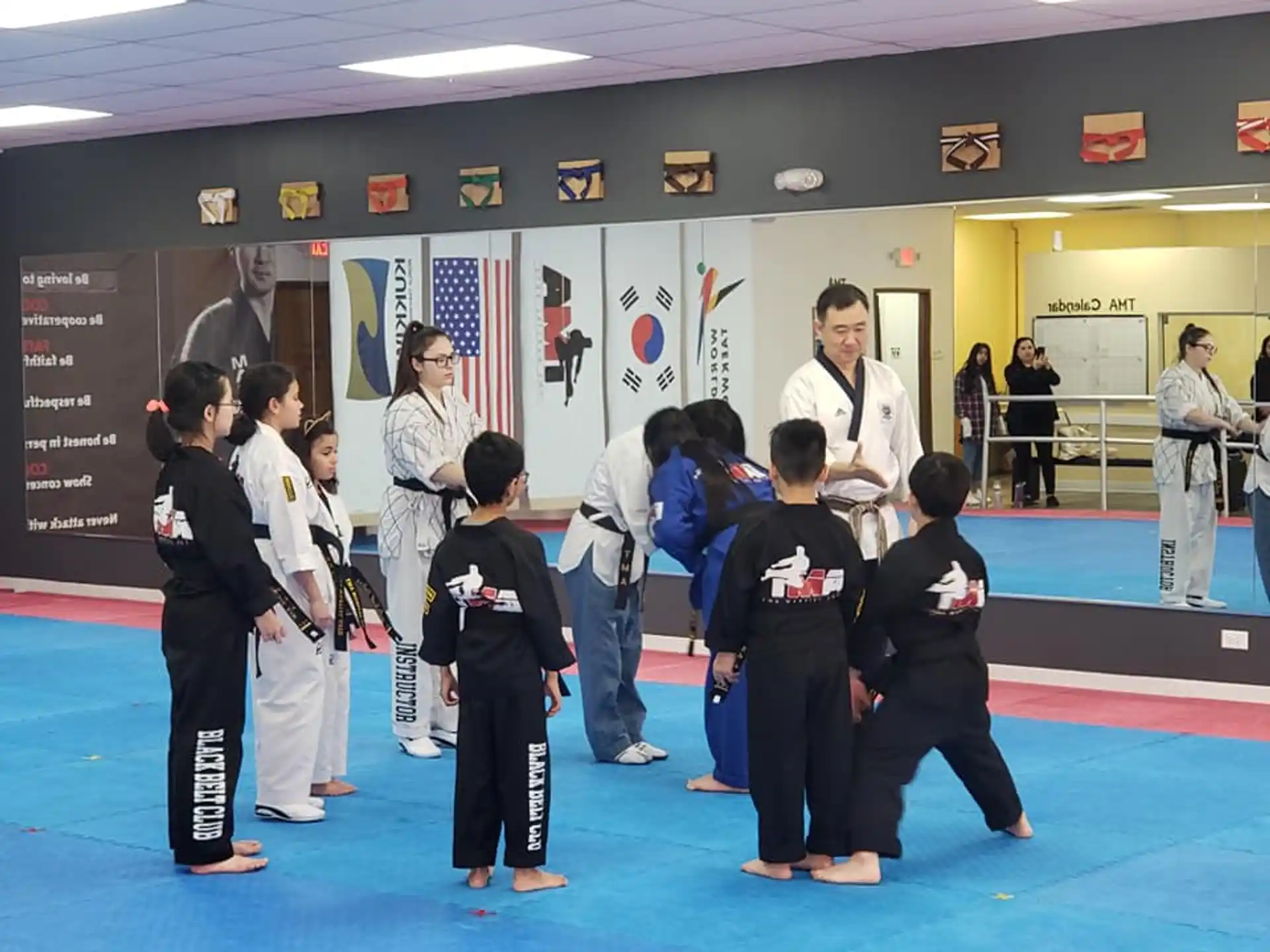 a group of people in karate uniforms