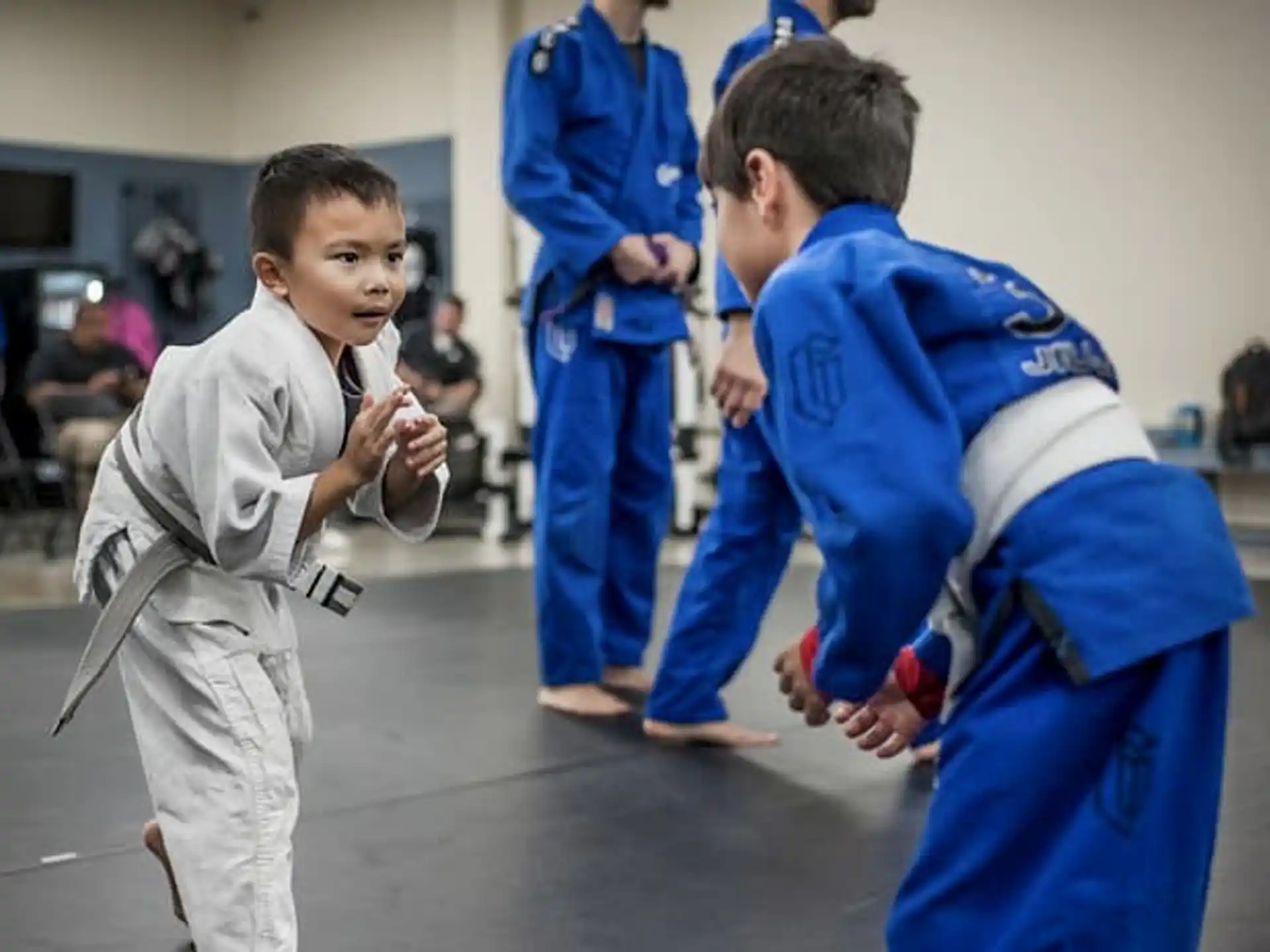a boy and a girl in karate uniforms