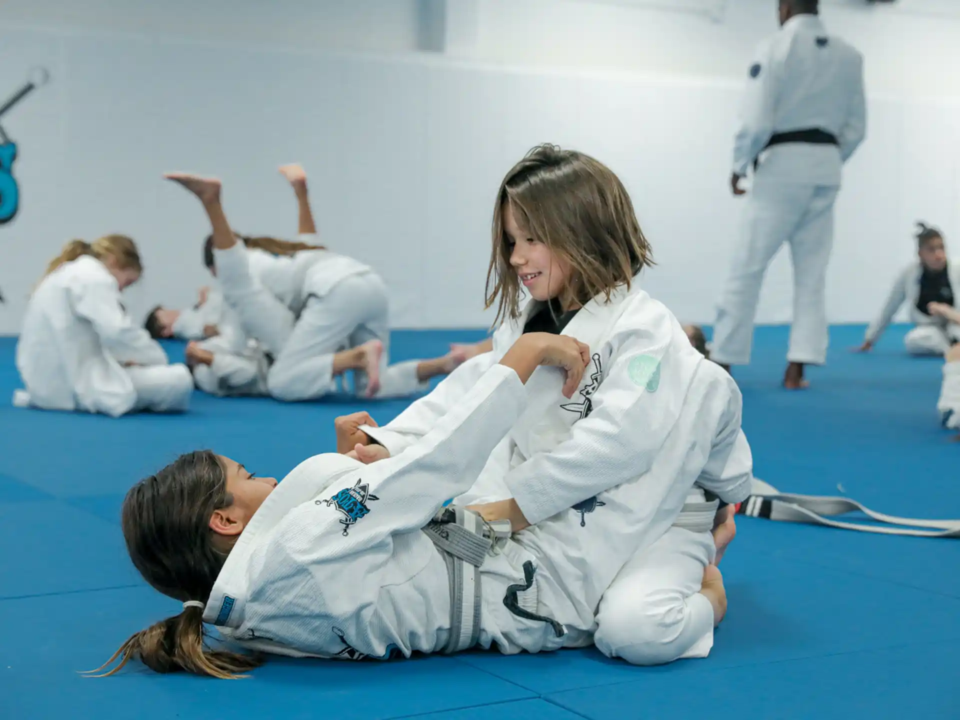 a group of people in karate uniforms