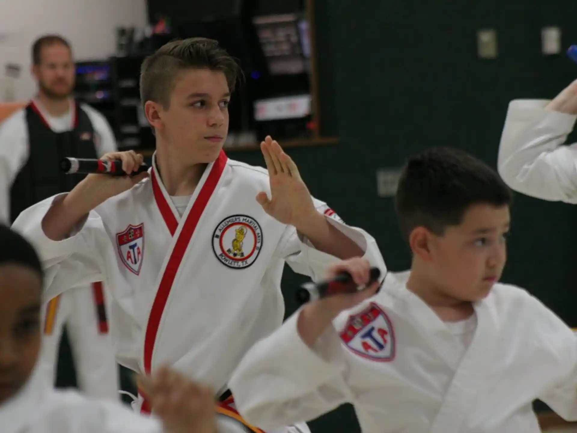 a group of boys in white uniforms