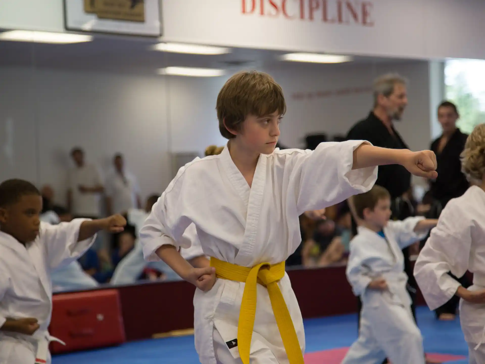 a group of people in karate uniforms