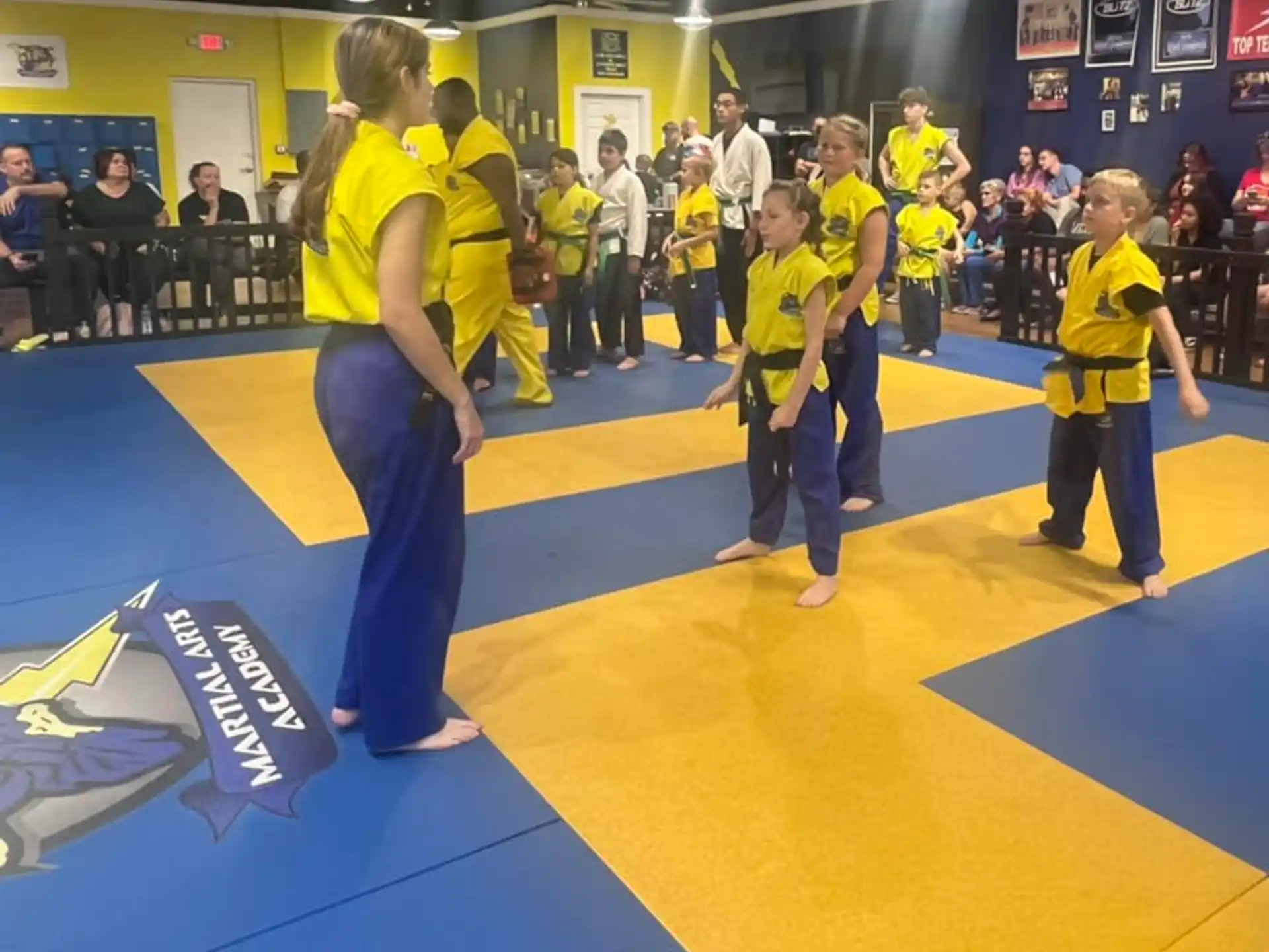 a group of people in yellow shirts
