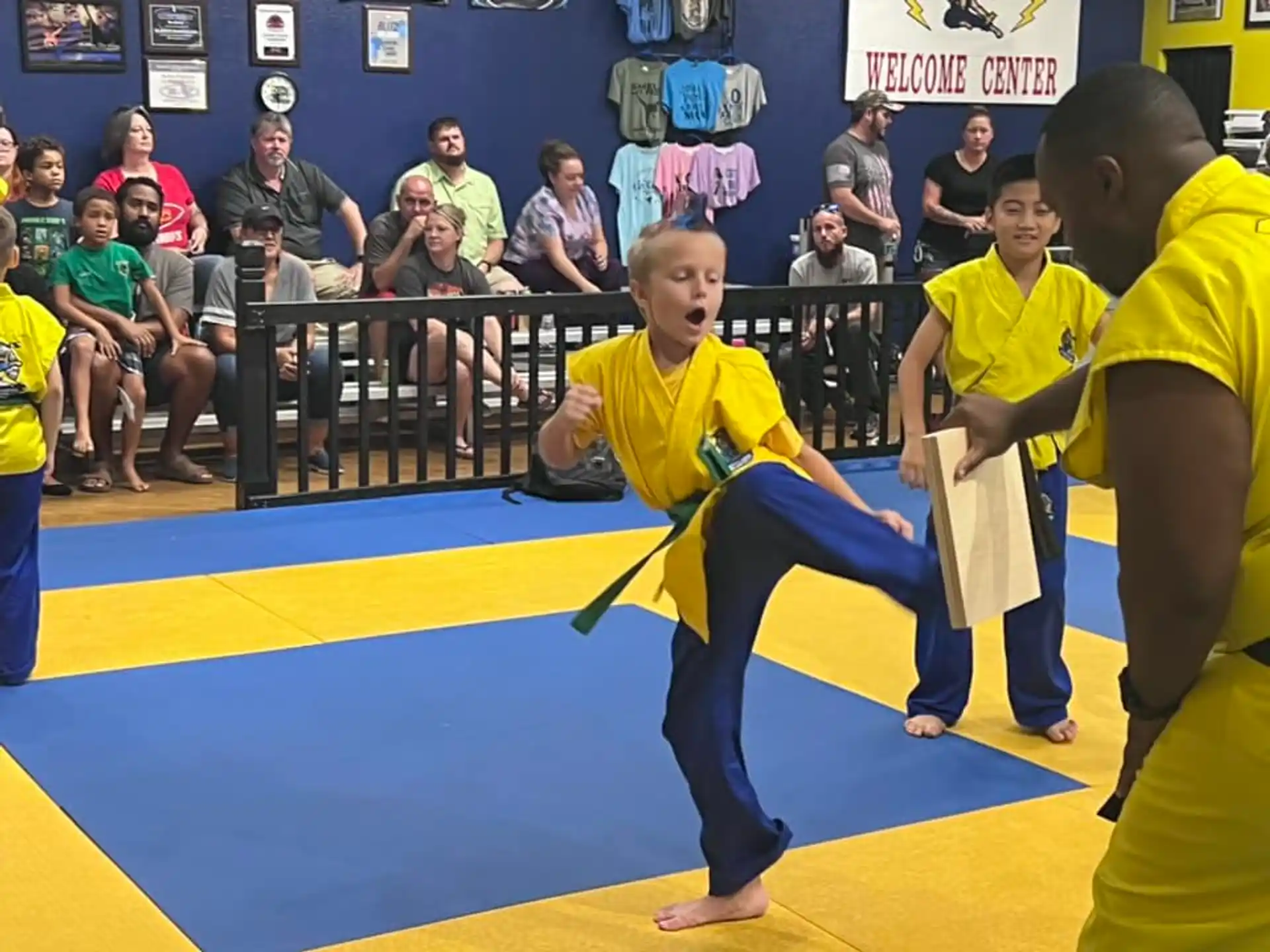 a group of people in yellow shirts