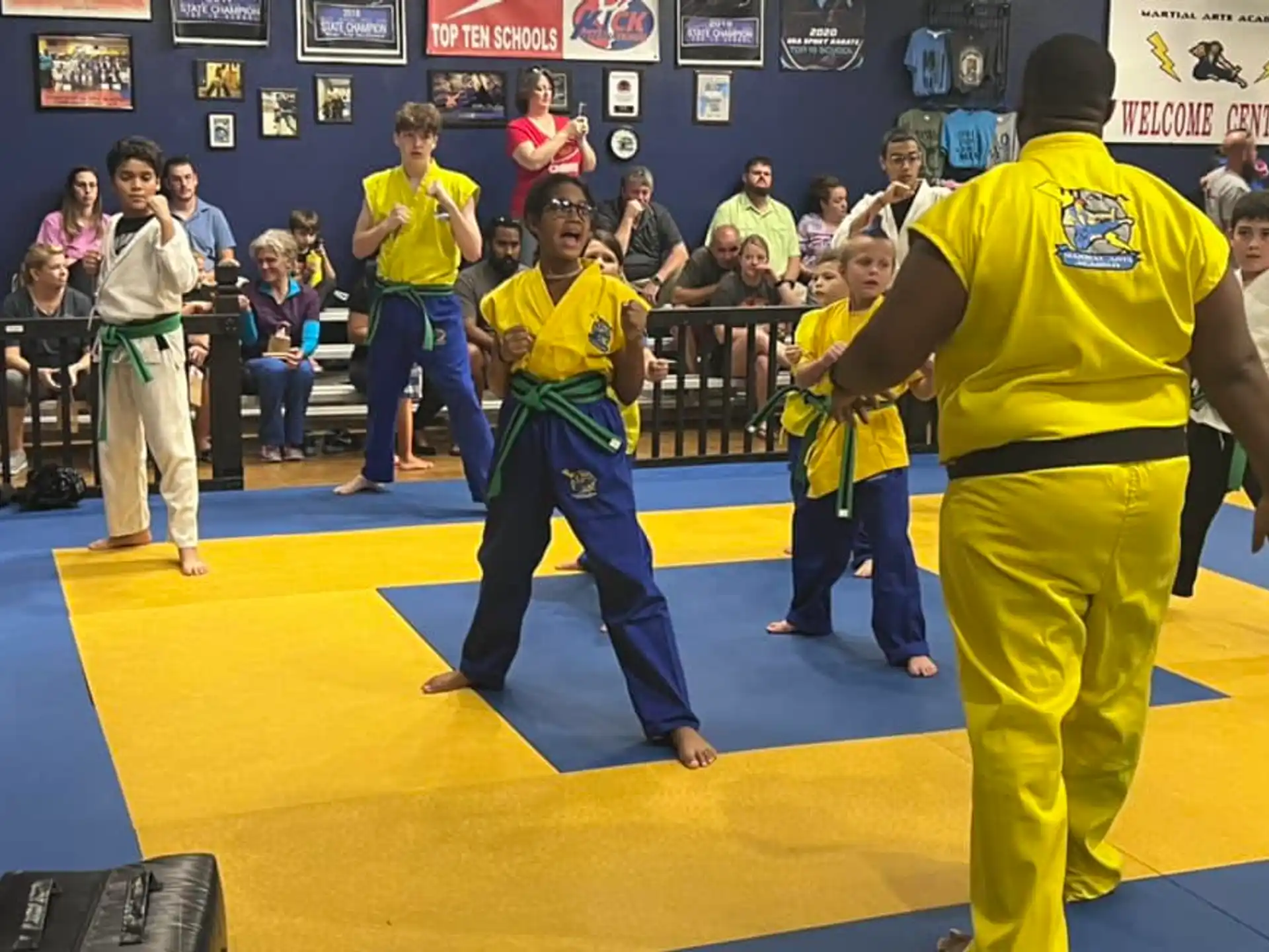 a group of people in yellow uniforms