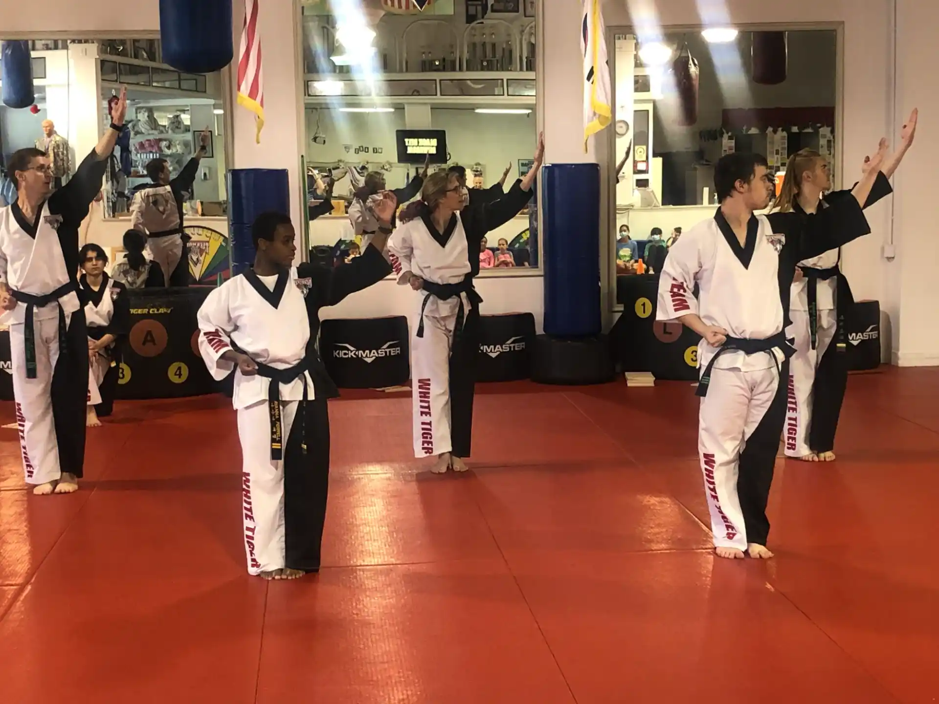 a group of people in karate uniforms