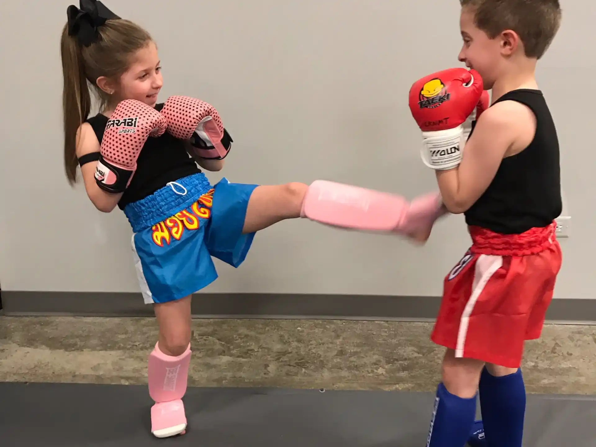 a couple of kids playing with a ball