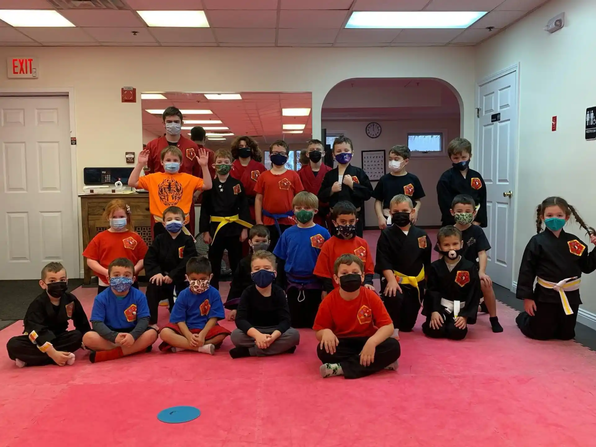 a group of people wearing masks