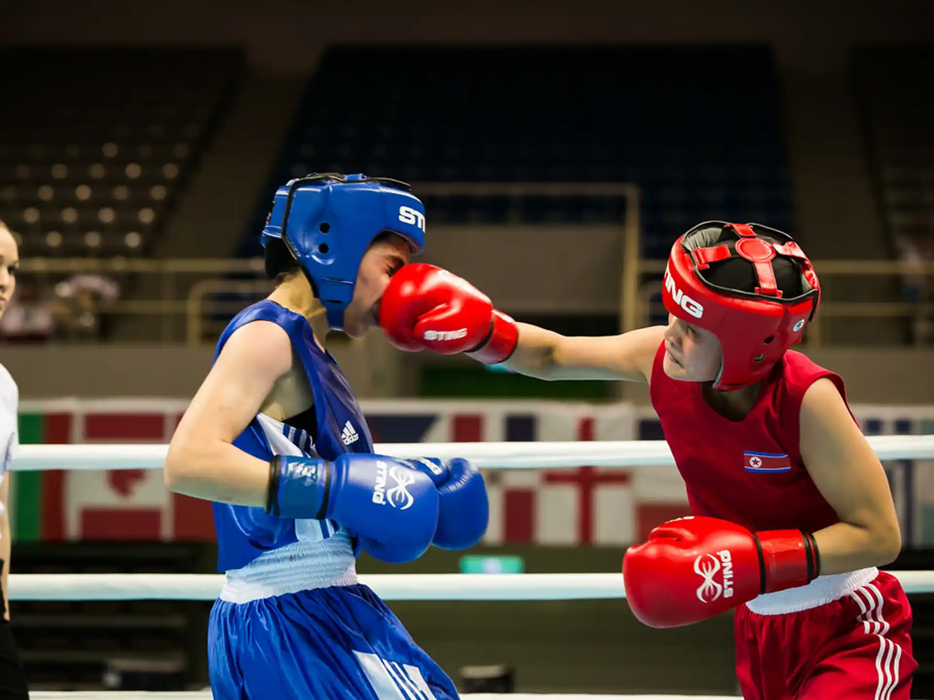 a couple of people wearing boxing gloves