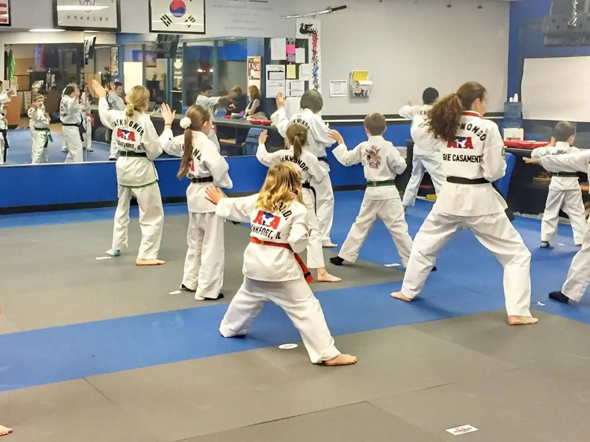 a group of people in karate uniforms