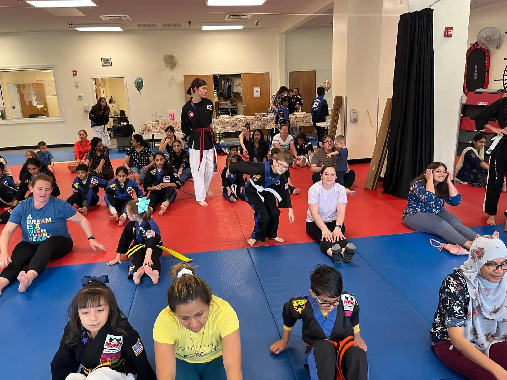 a group of people sitting on the floor