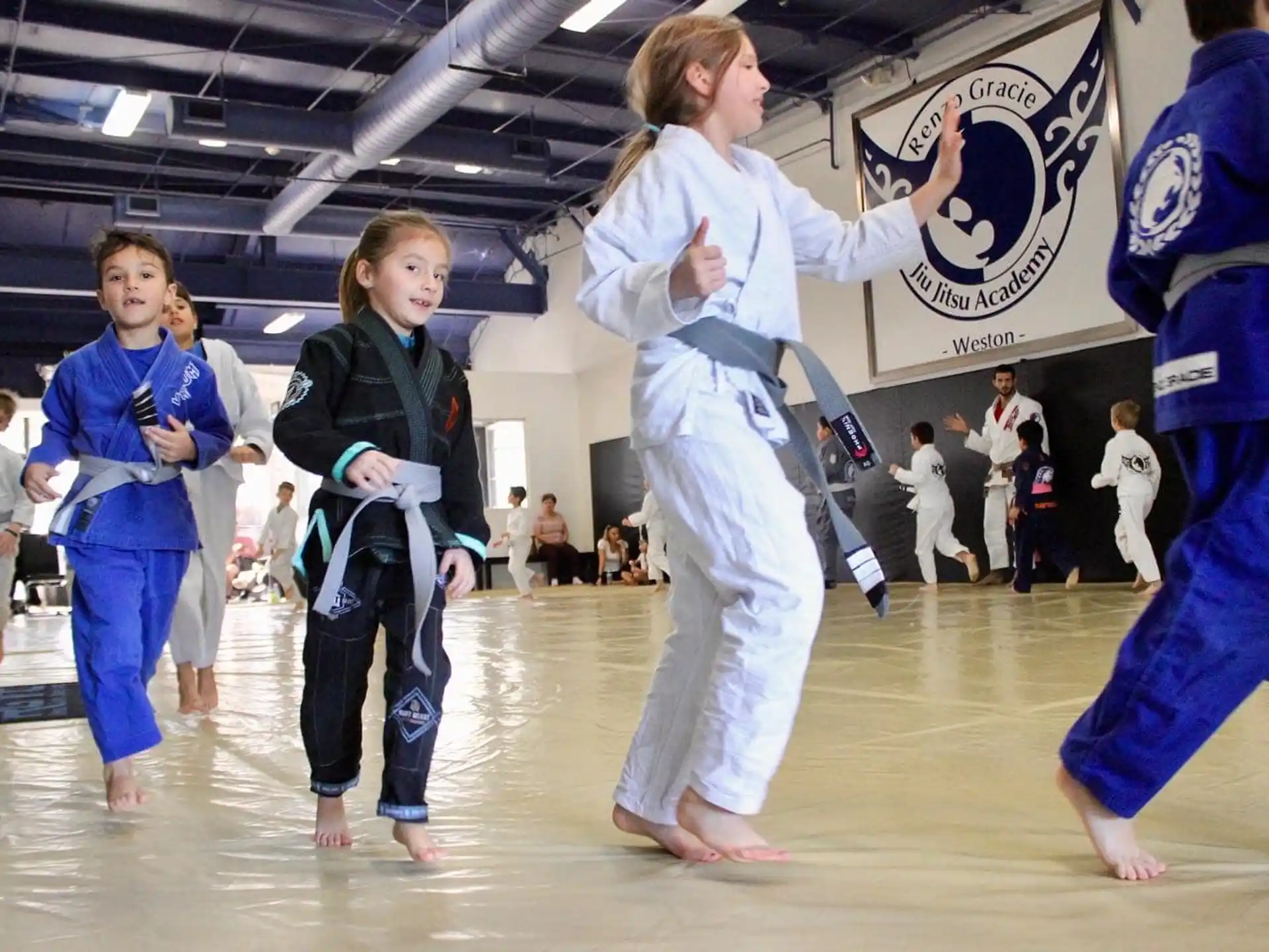 a group of people in karate uniforms