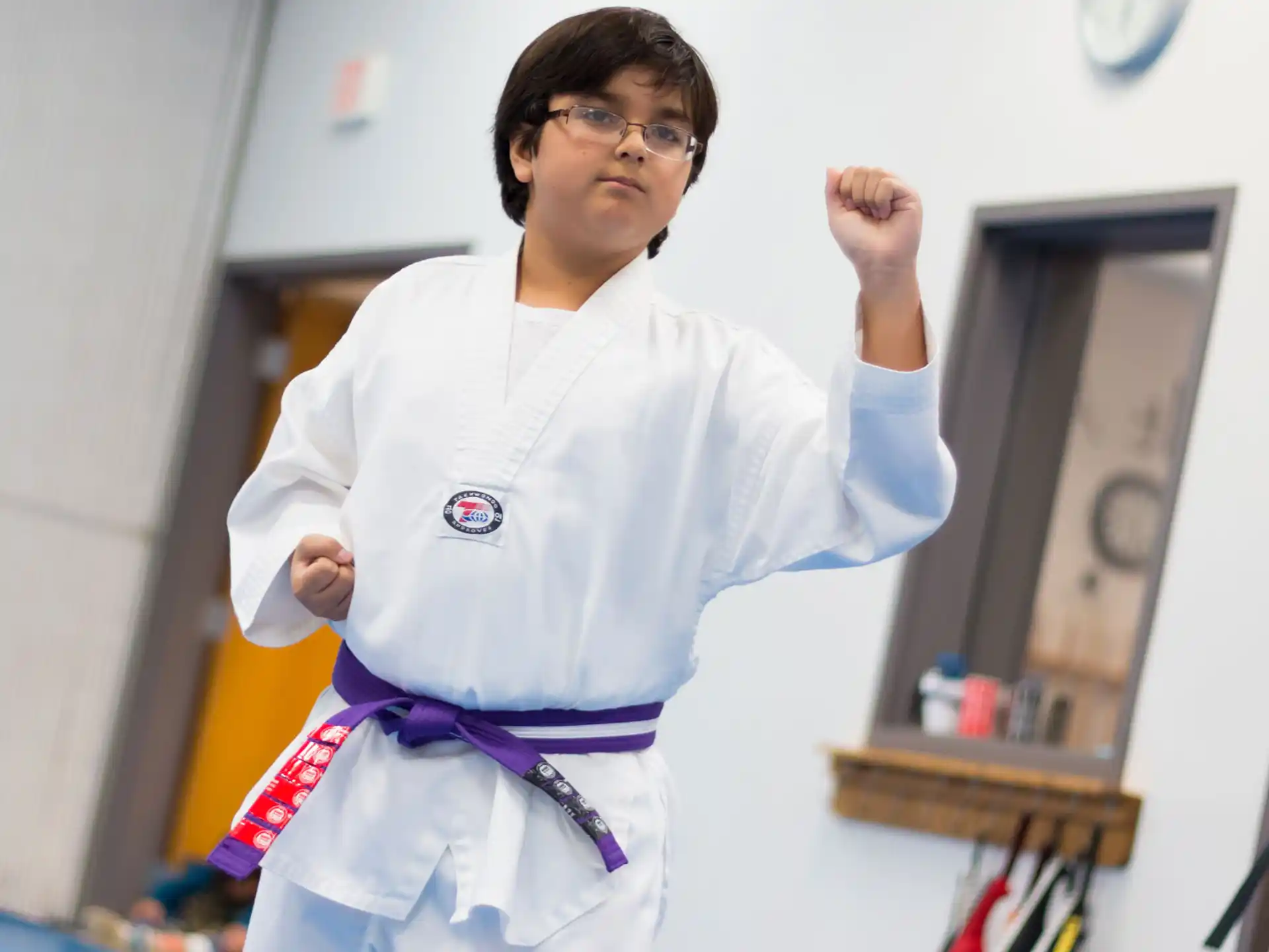 a boy wearing a karate uniform