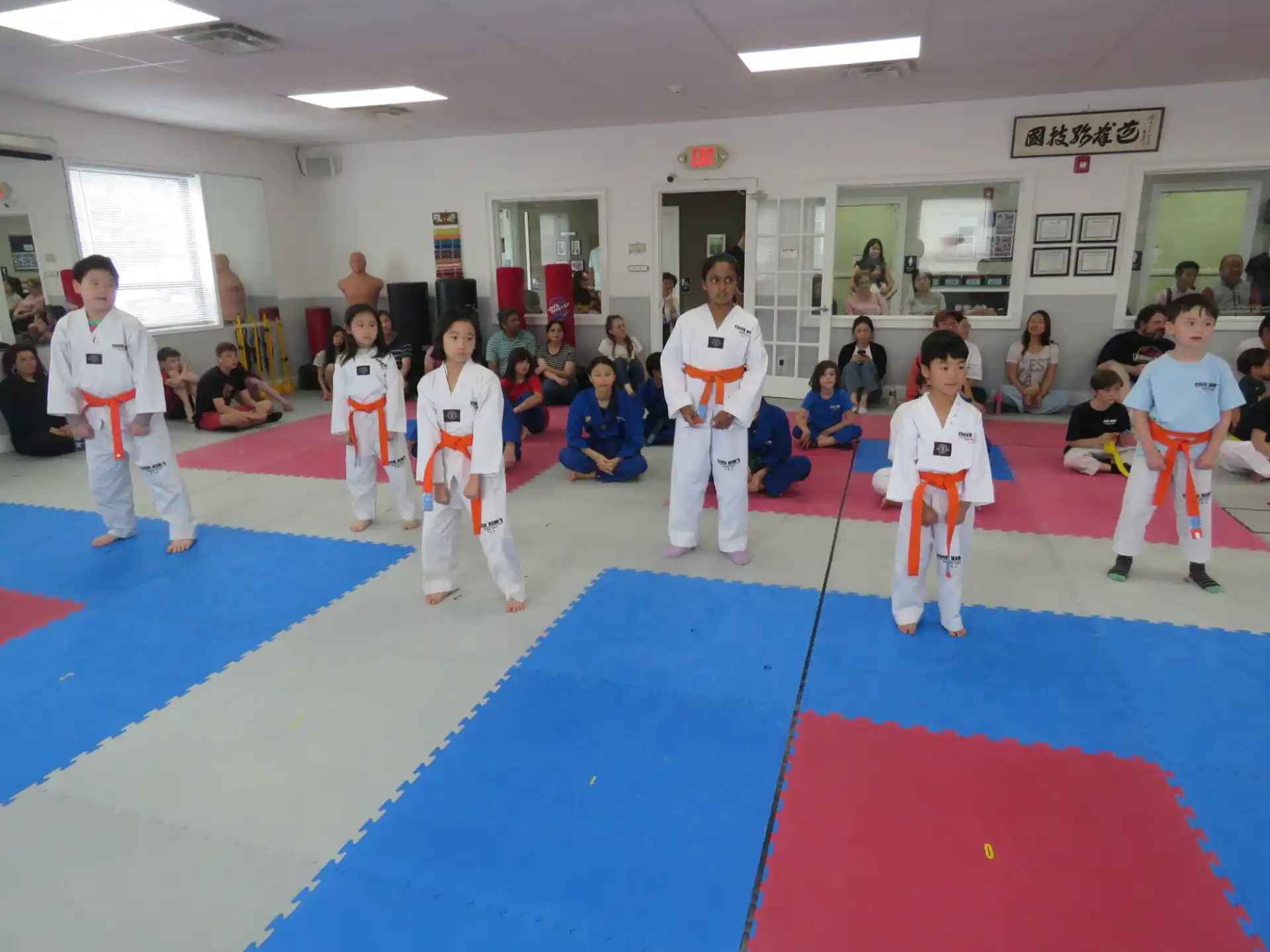 a group of people in karate uniforms