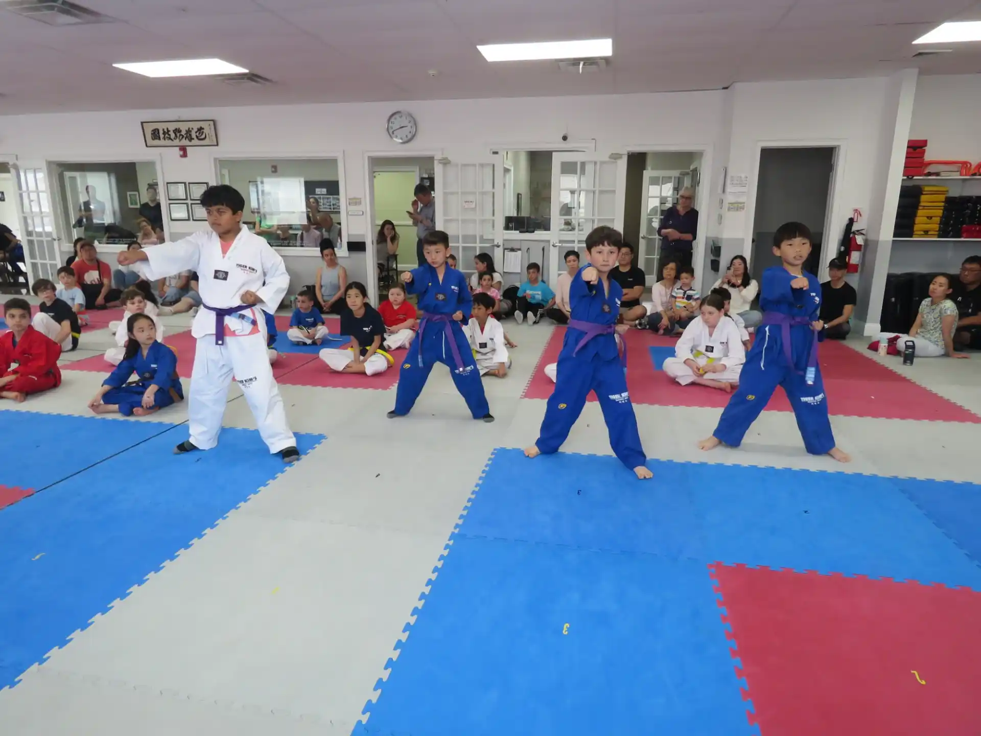 a group of people in karate uniforms