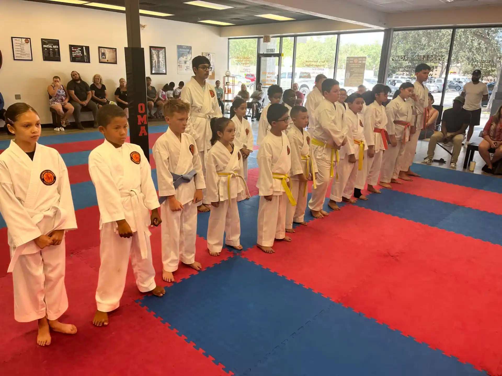 a group of people in karate uniforms