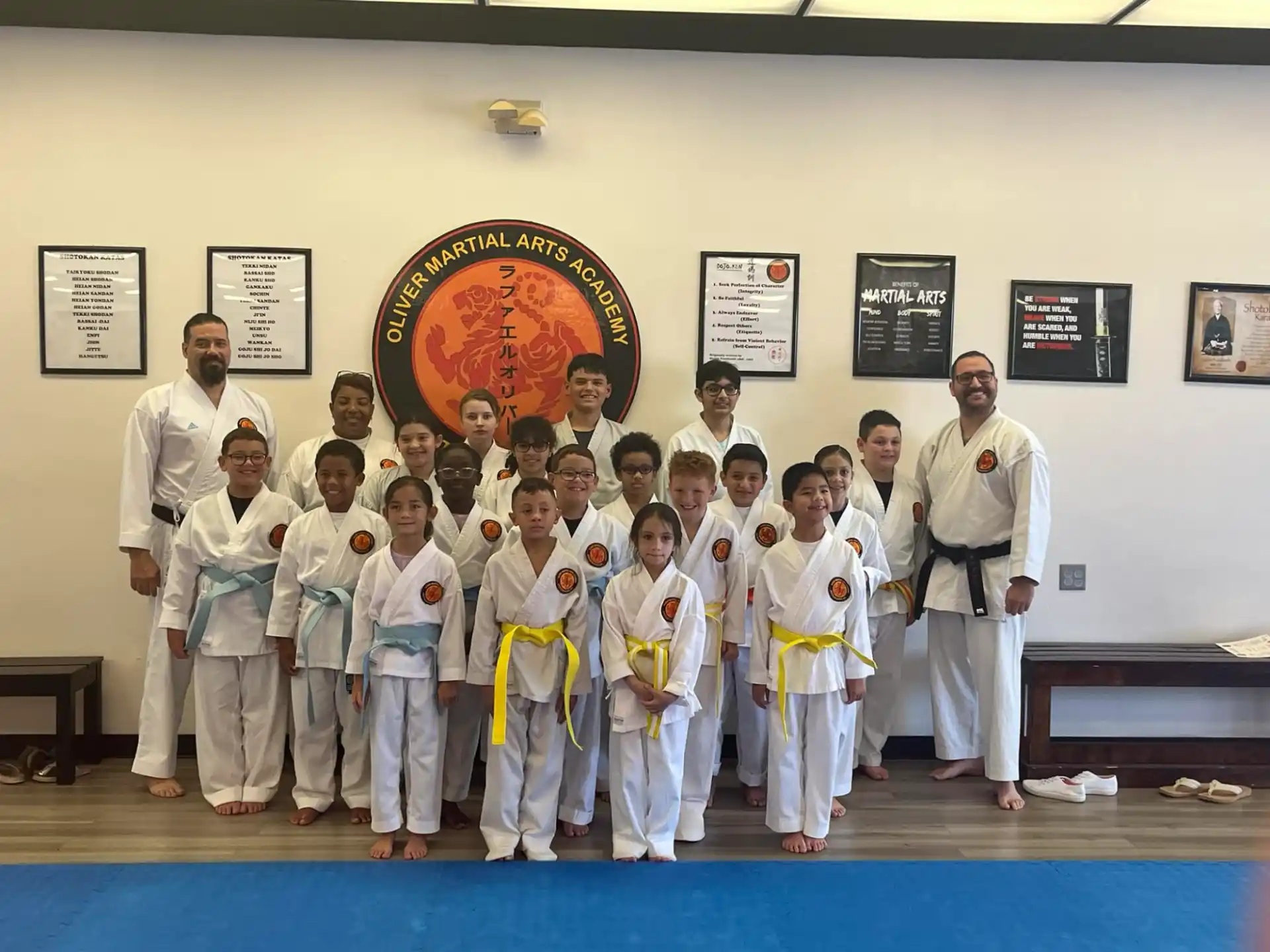 a group of people in karate uniforms