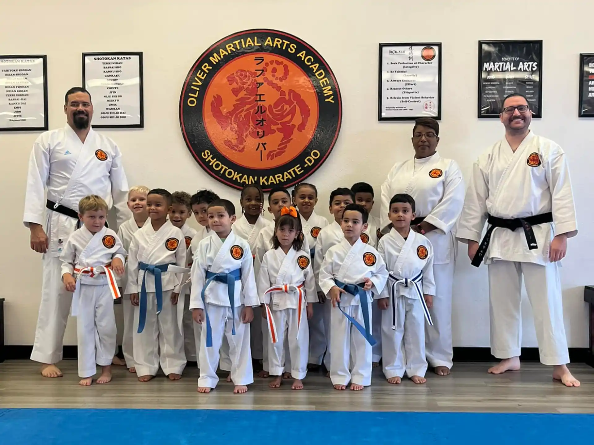 a group of people in karate uniforms