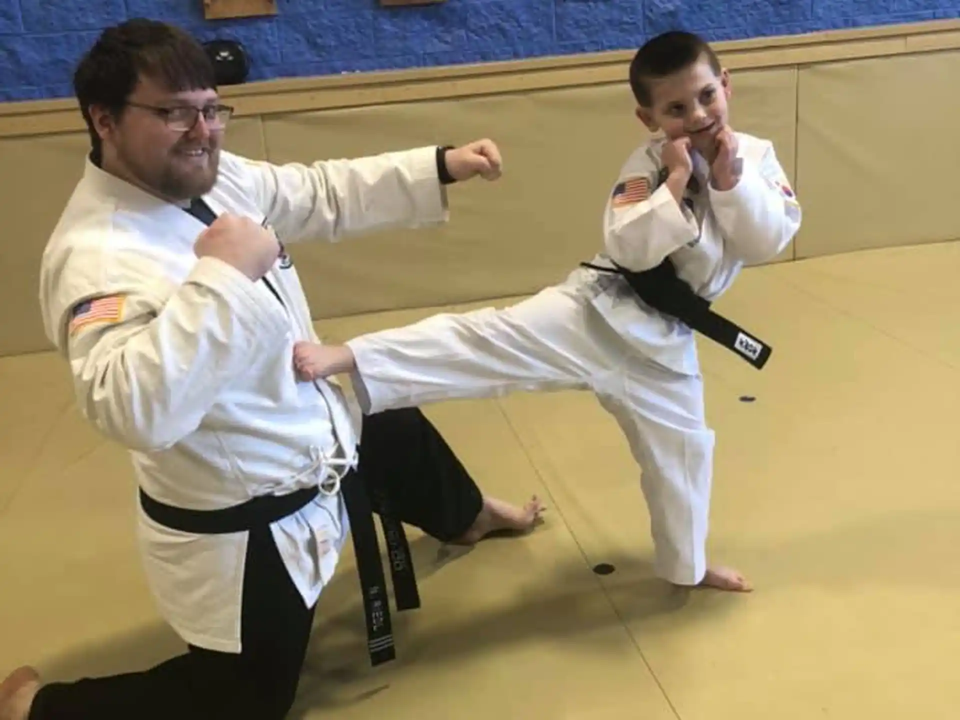 a couple of men in karate uniforms