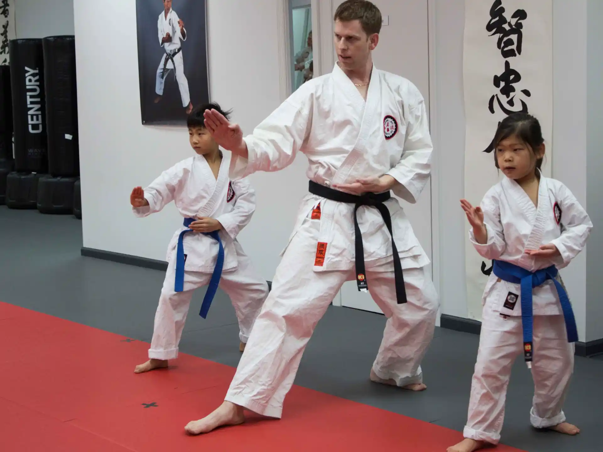 a group of people in karate uniforms