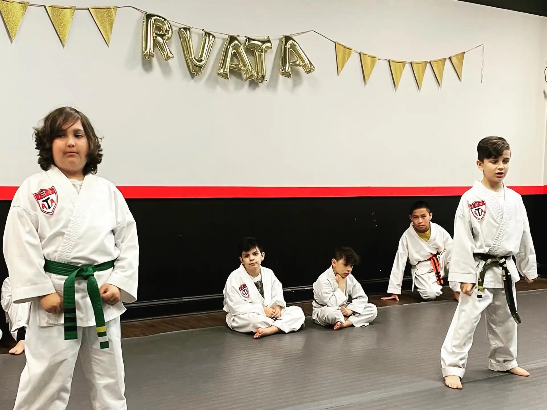 a group of people in karate uniforms