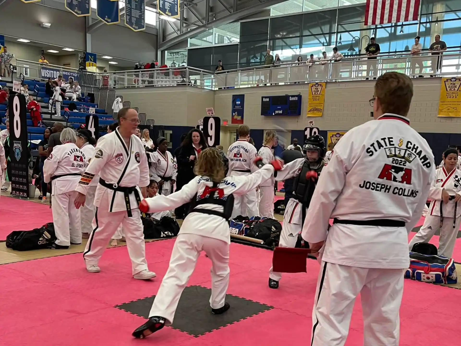 a group of people in karate uniforms