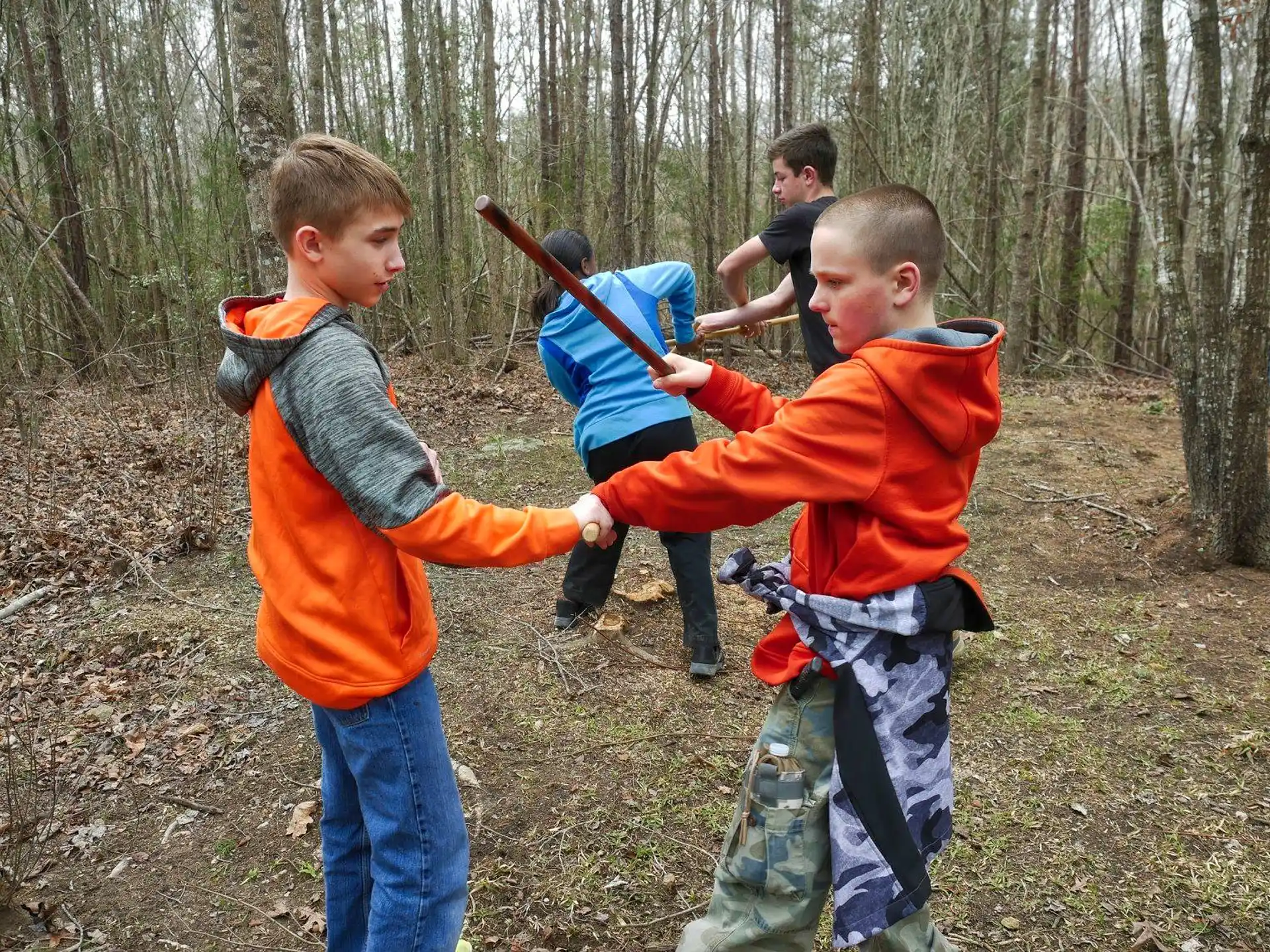 a group of boys in a forest