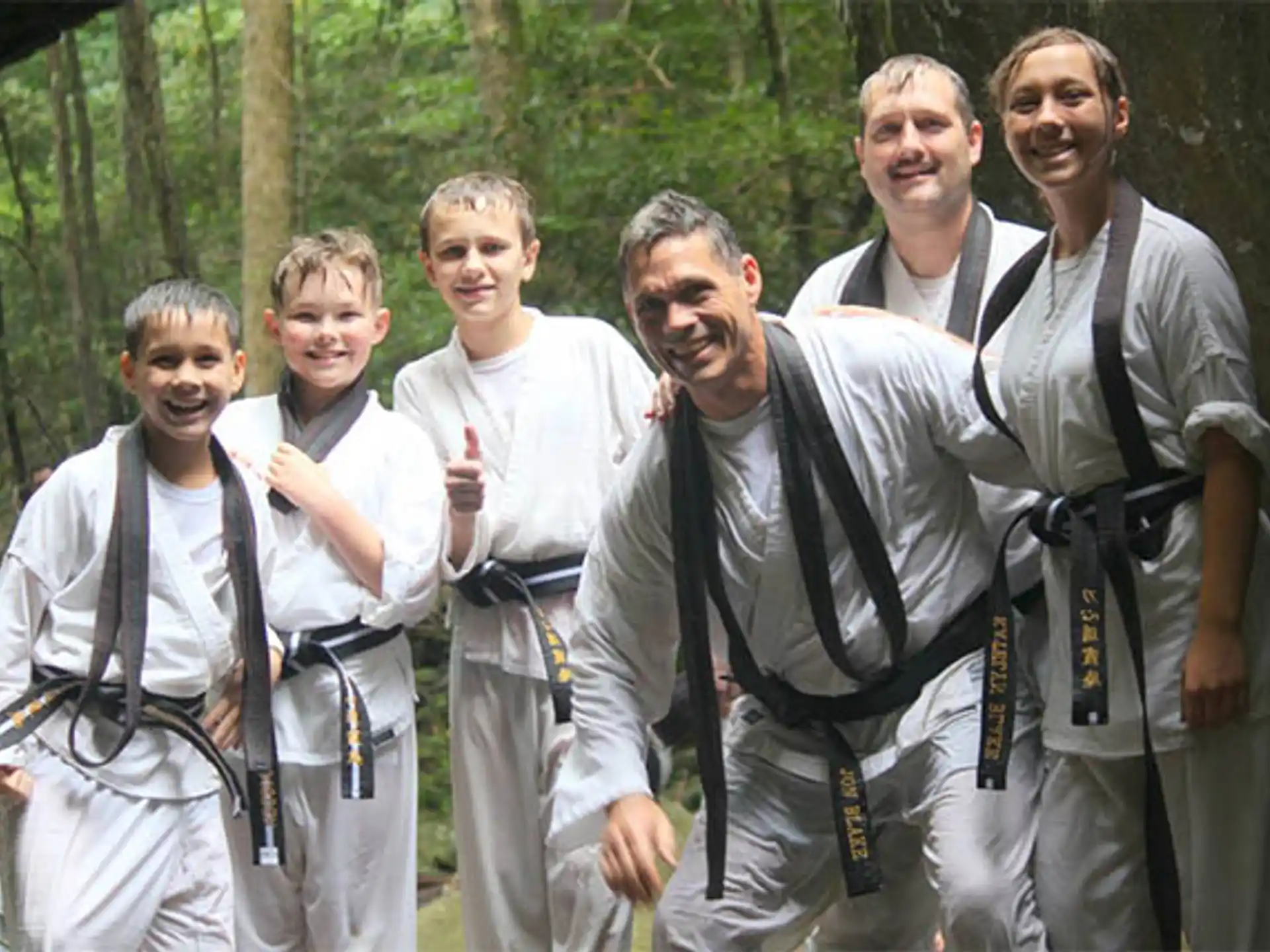 a group of men wearing suspenders