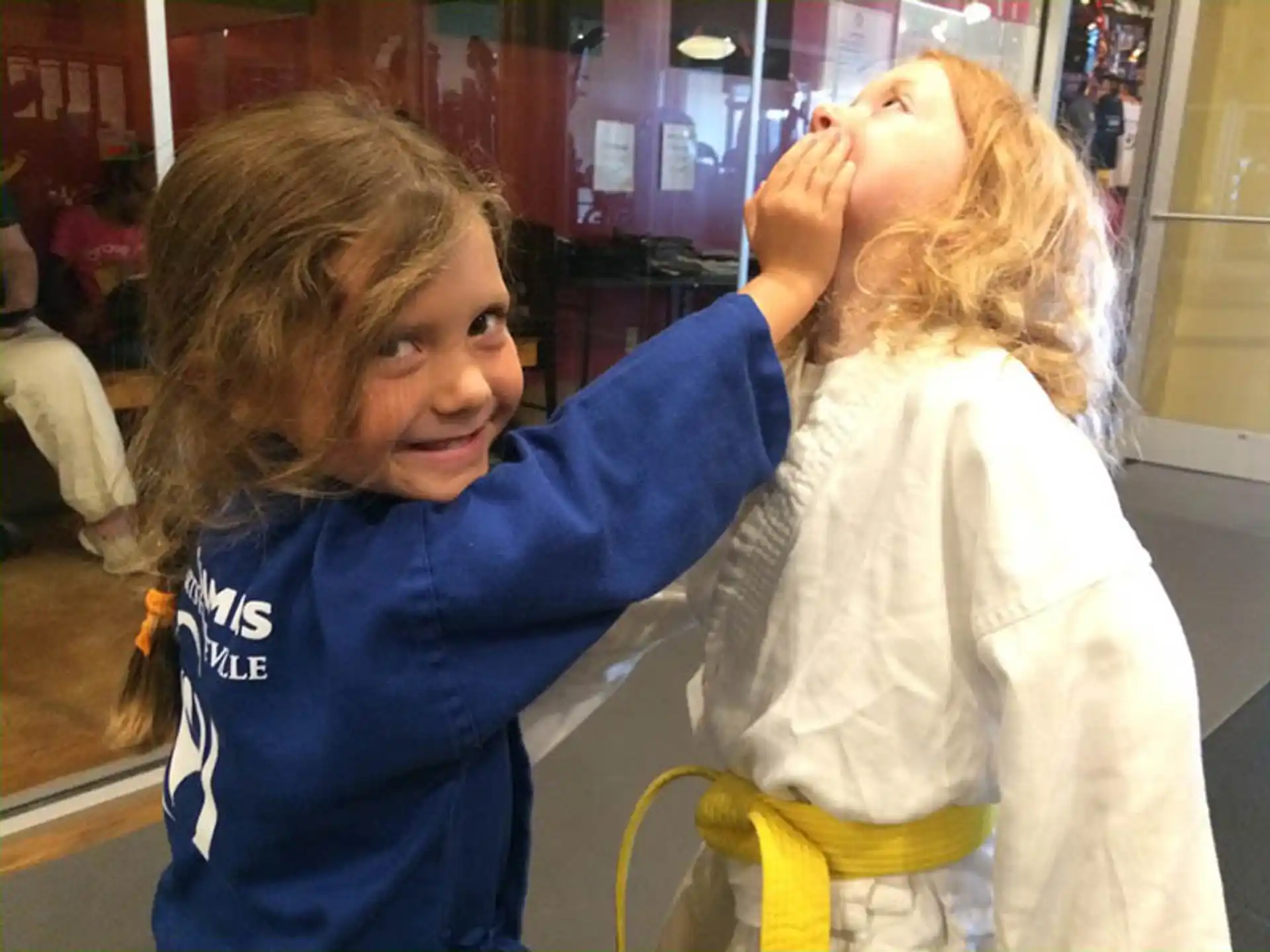 a person with the hand on another woman's head