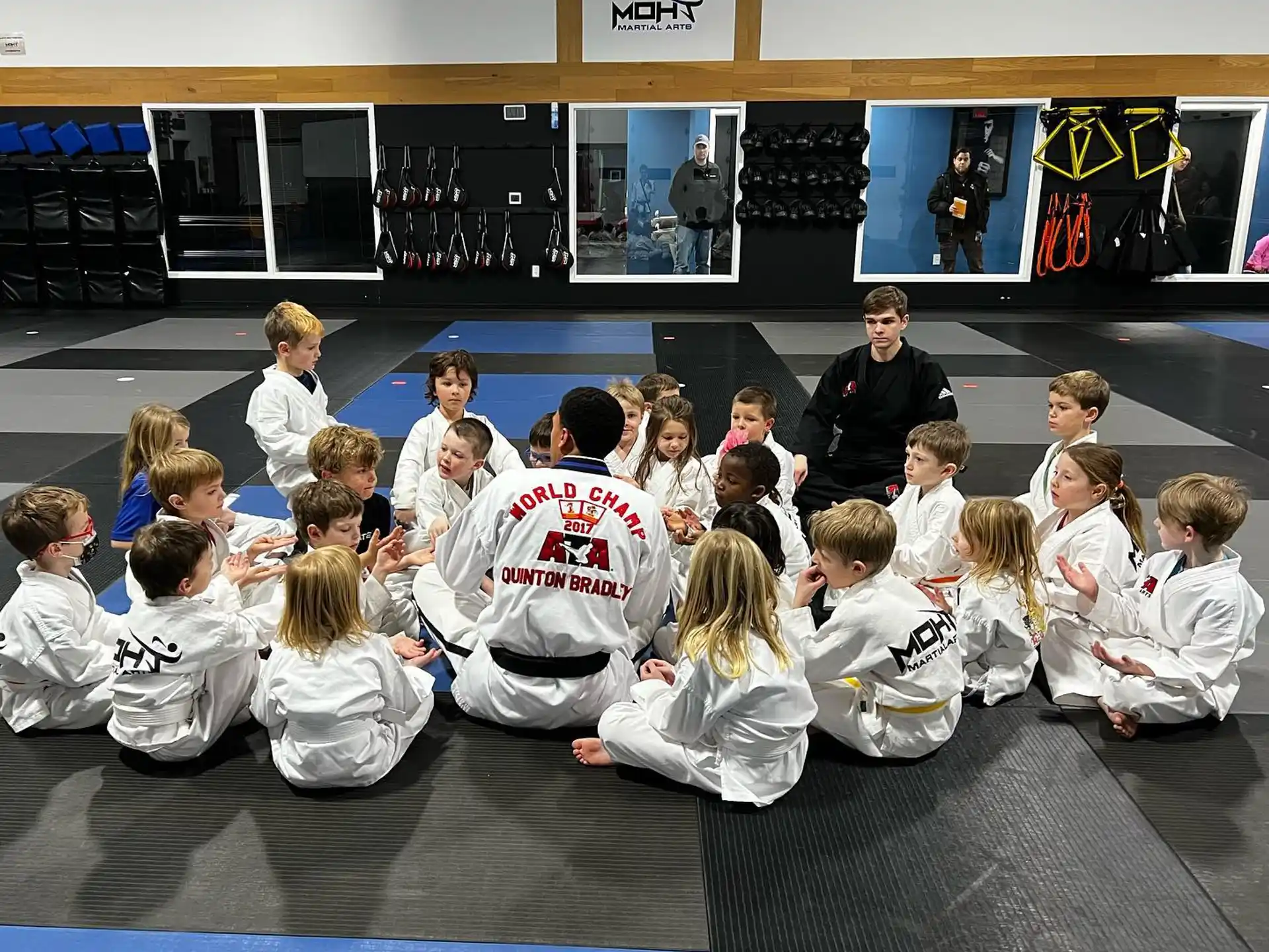 a group of people sitting on the floor
