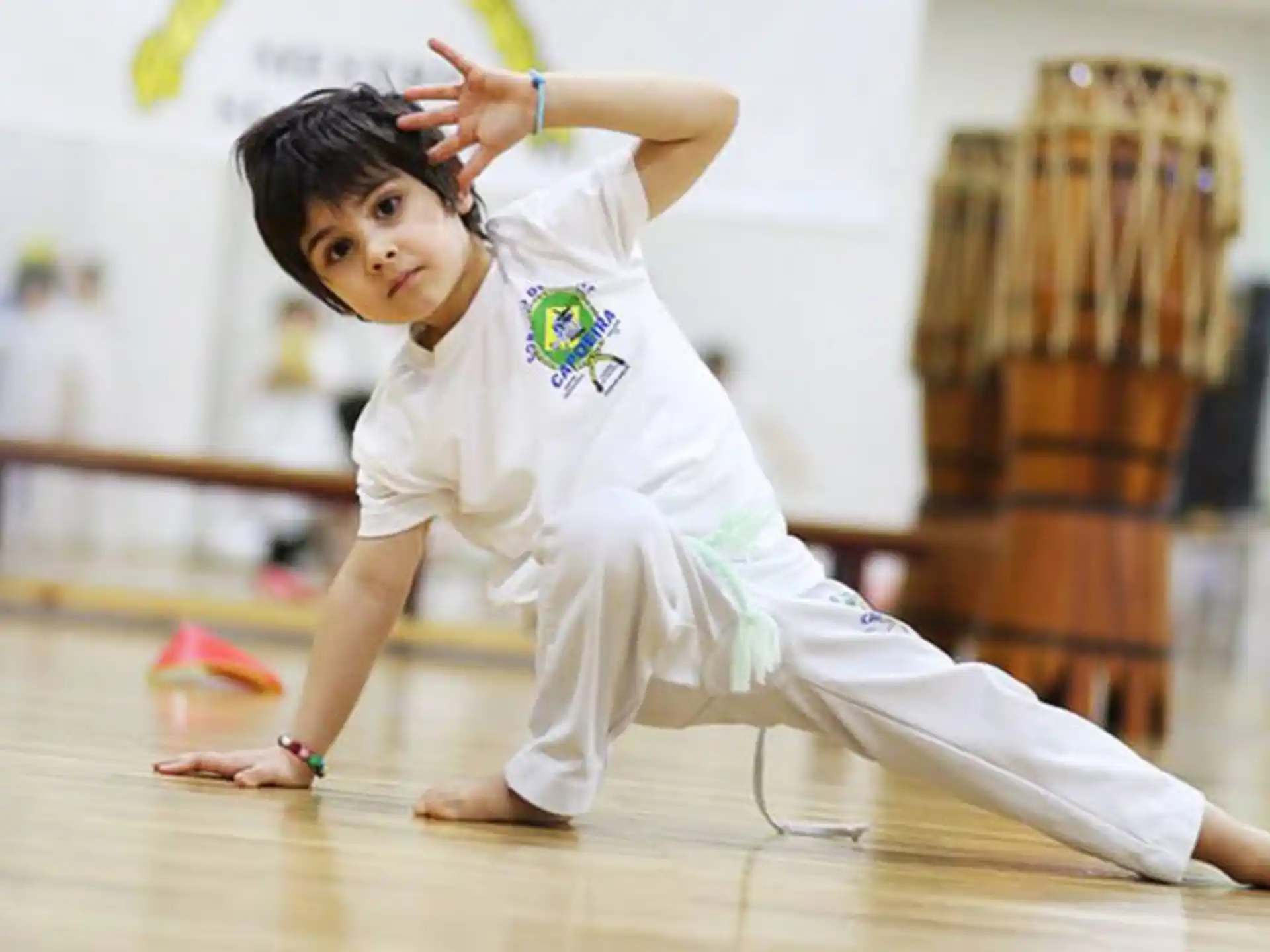 a young girl doing a karate move