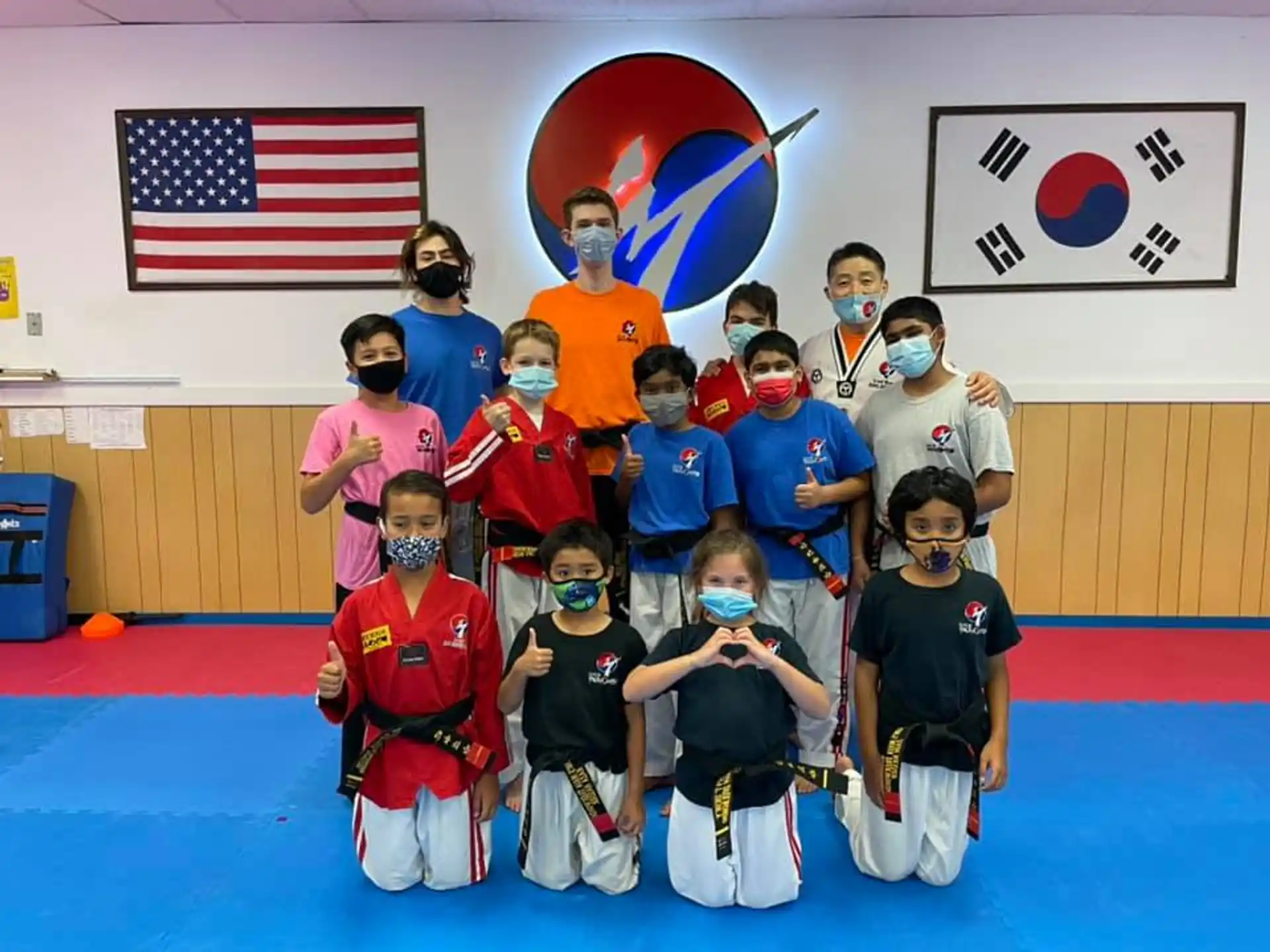 a group of kids posing for a photo