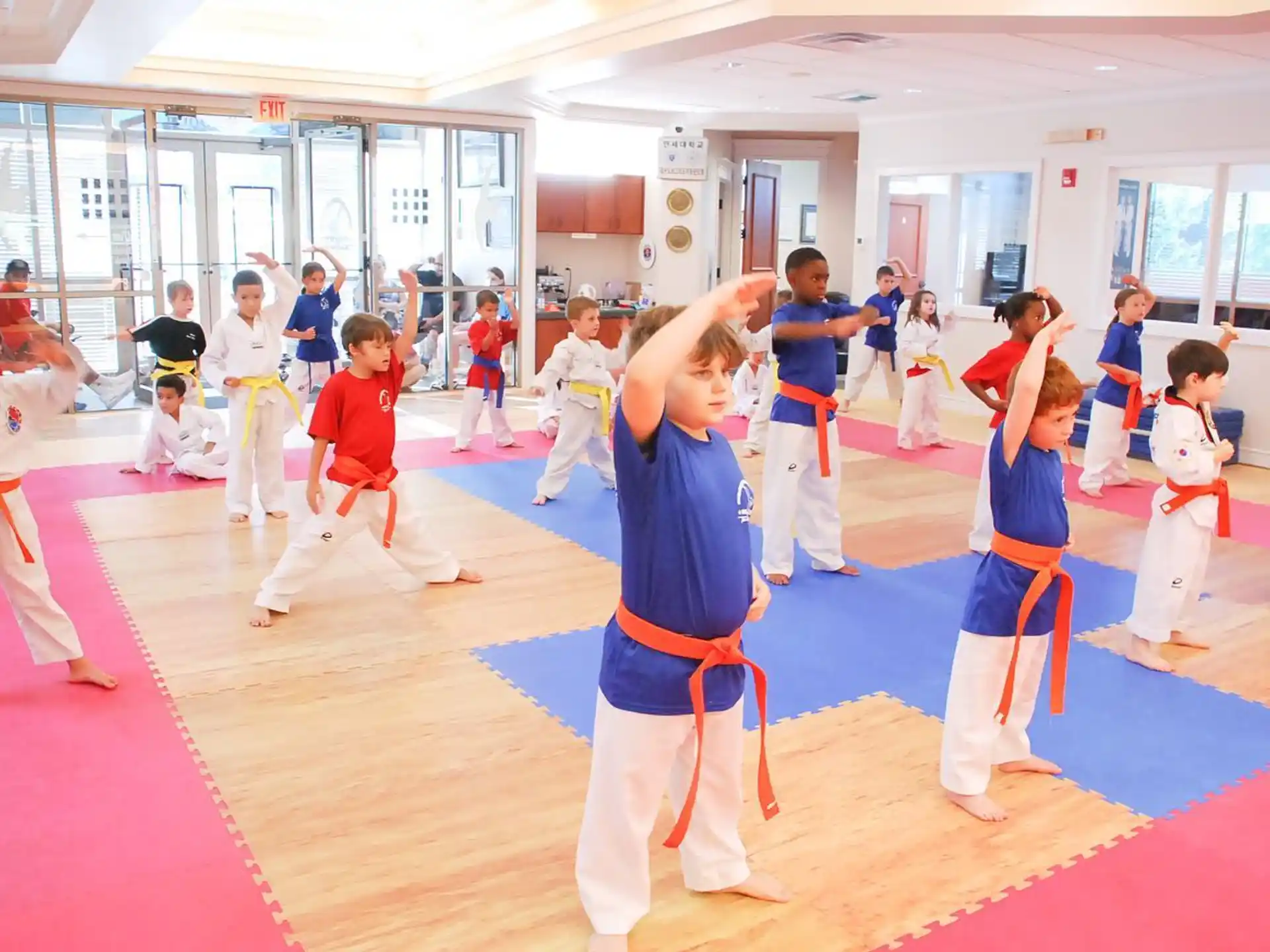a group of people in karate uniforms
