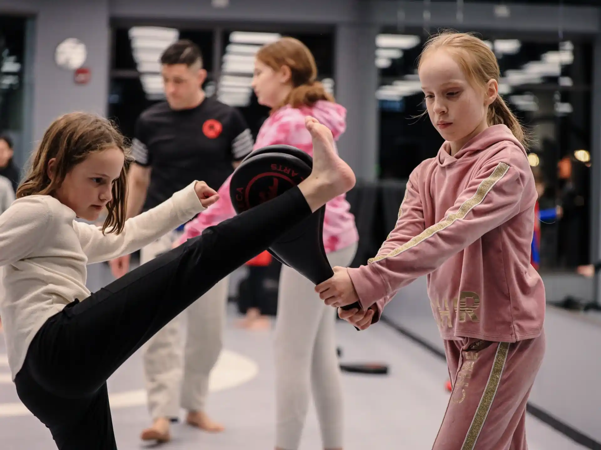 a group of women in martial arts uniforms