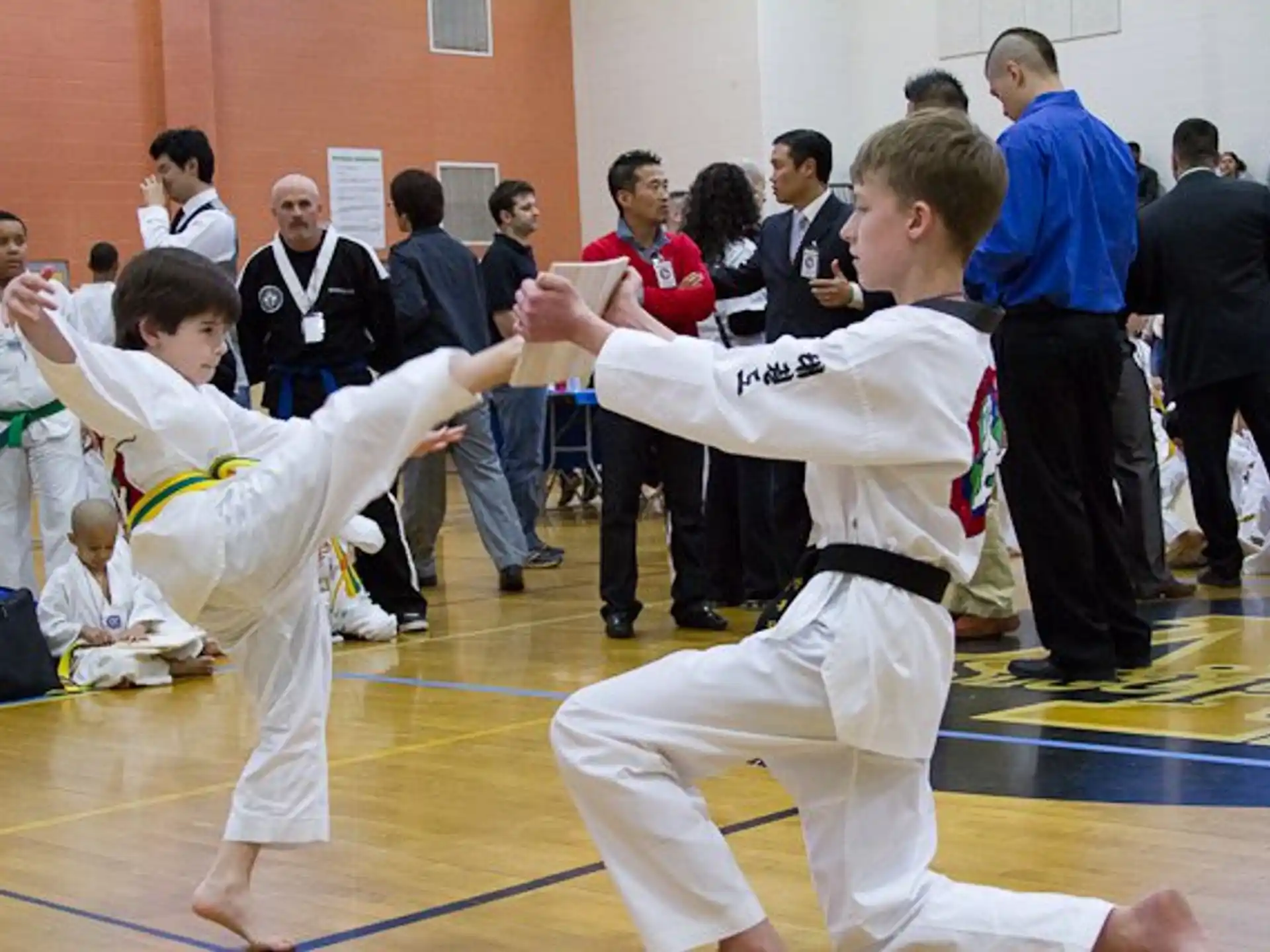 a group of people in karate uniforms