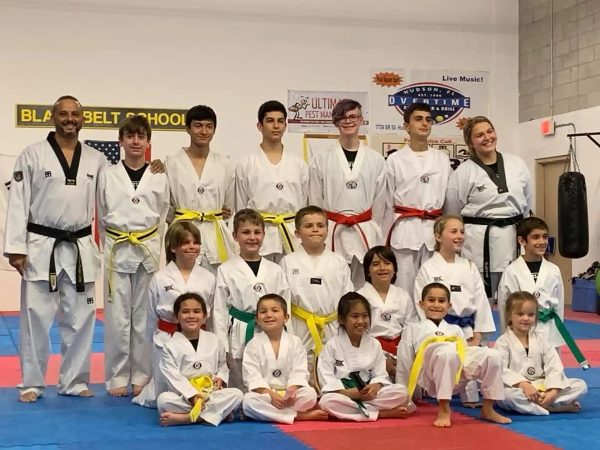 a group of people in karate uniforms