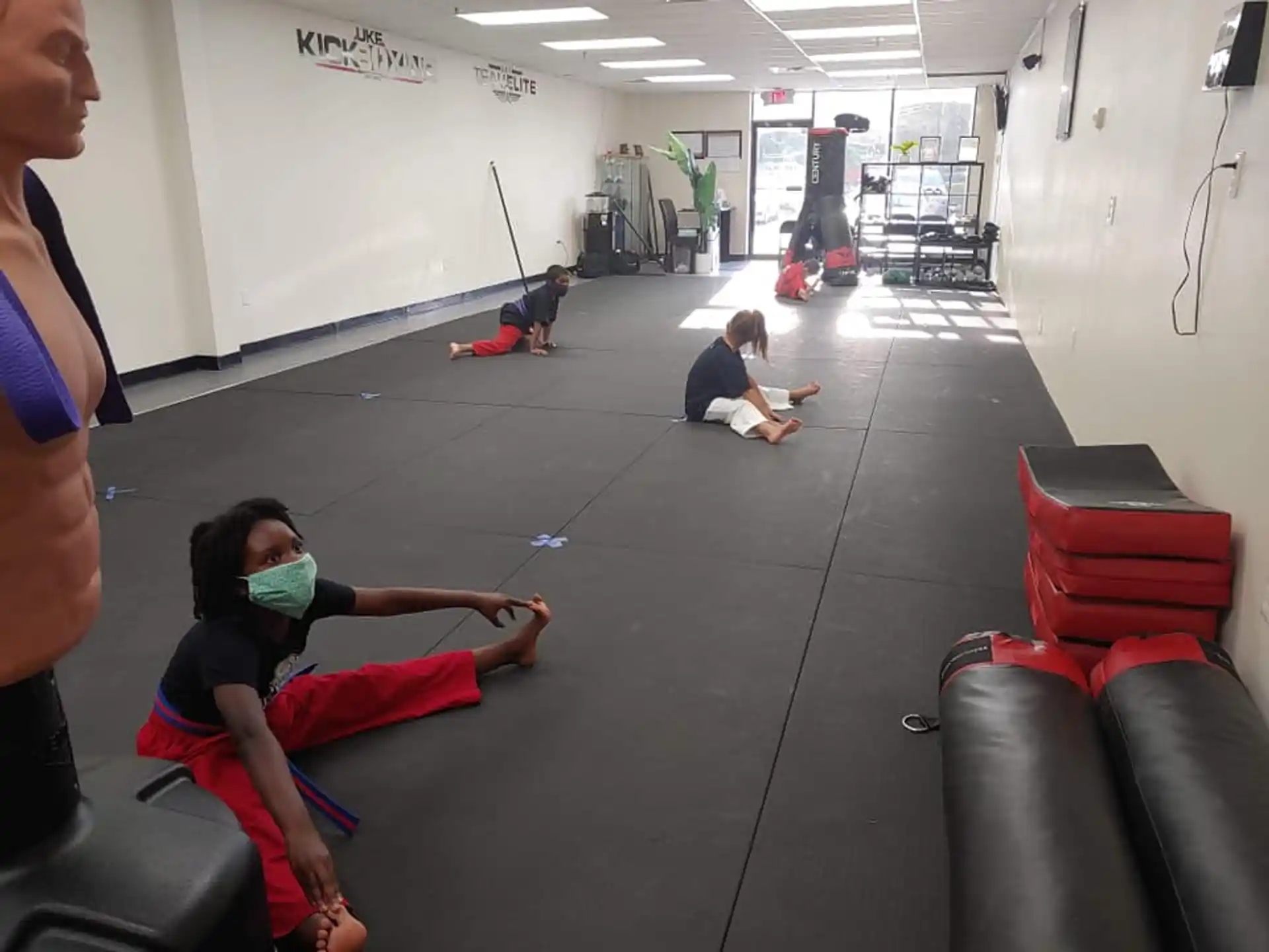 a group of people exercising in a gym