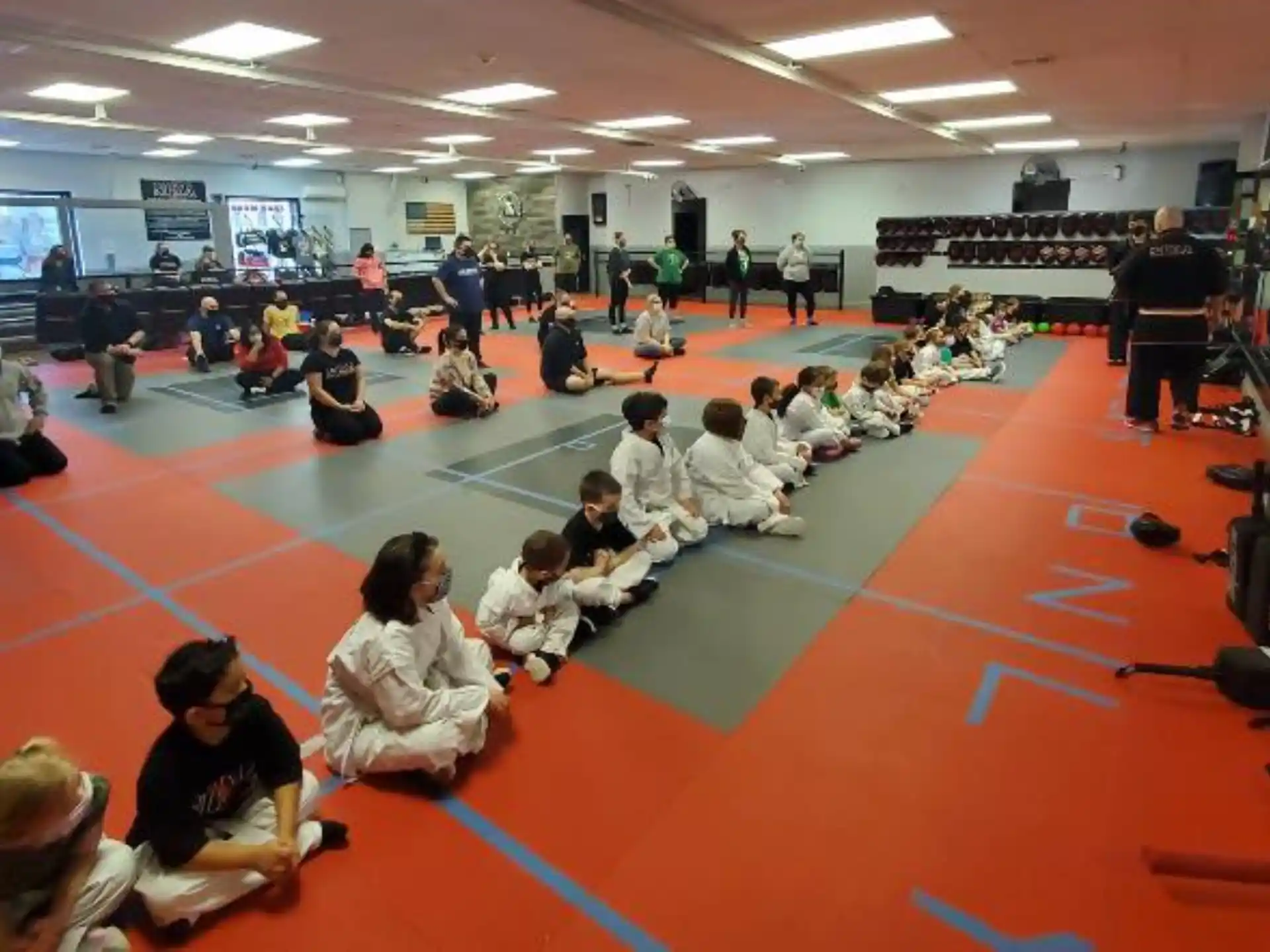 a group of people sitting on the floor in a room