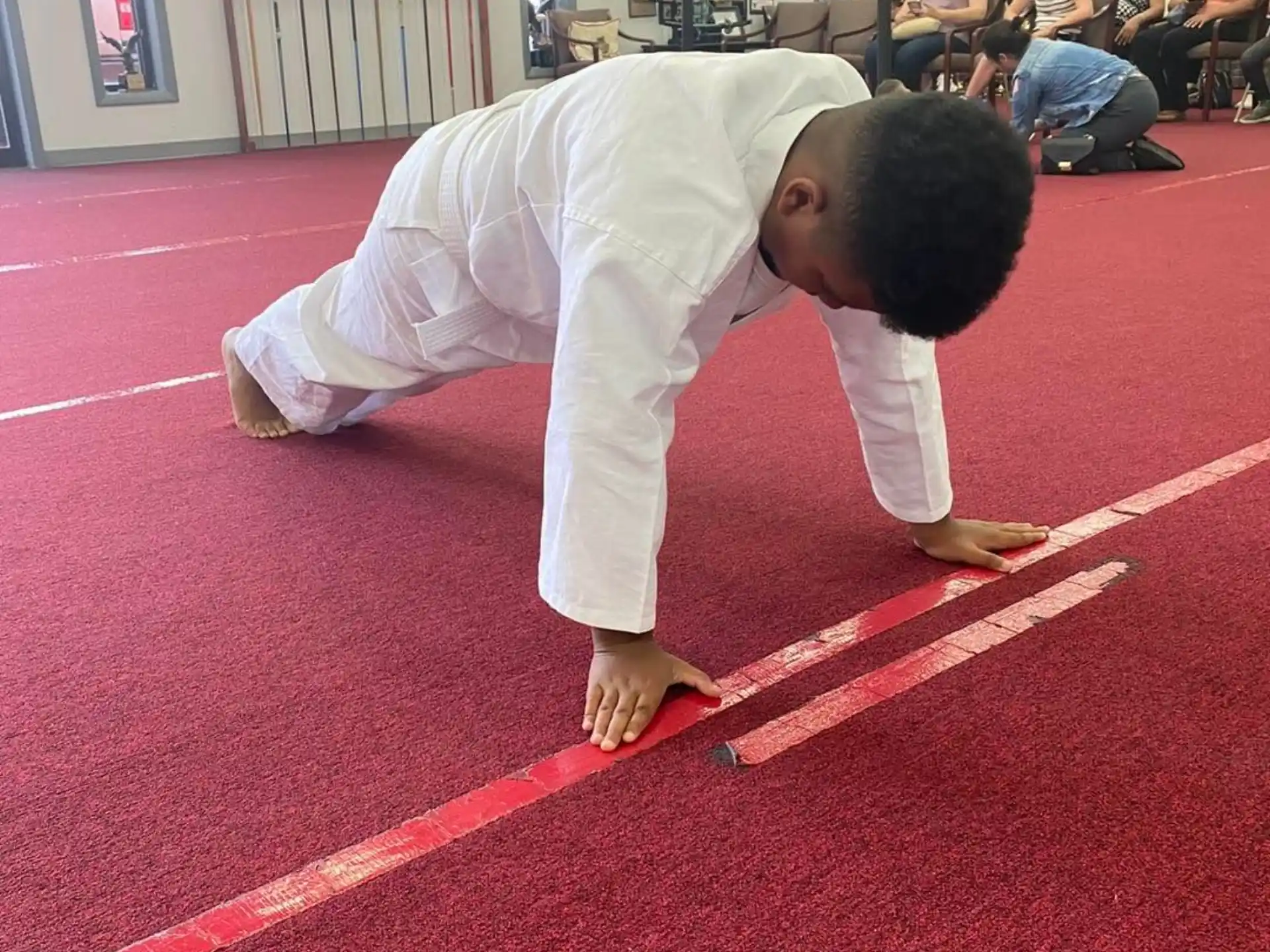 a boy doing a karate move
