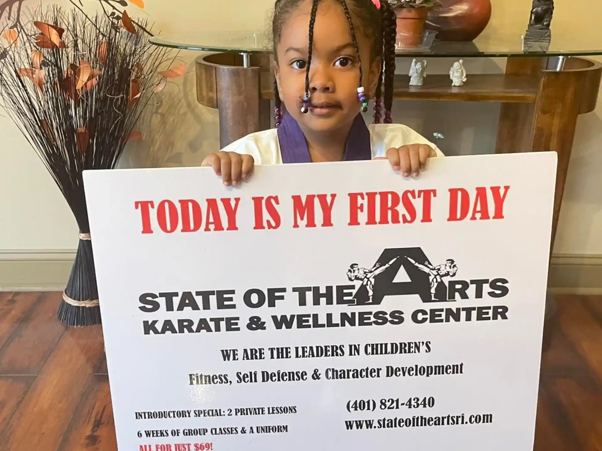 a girl holding a sign