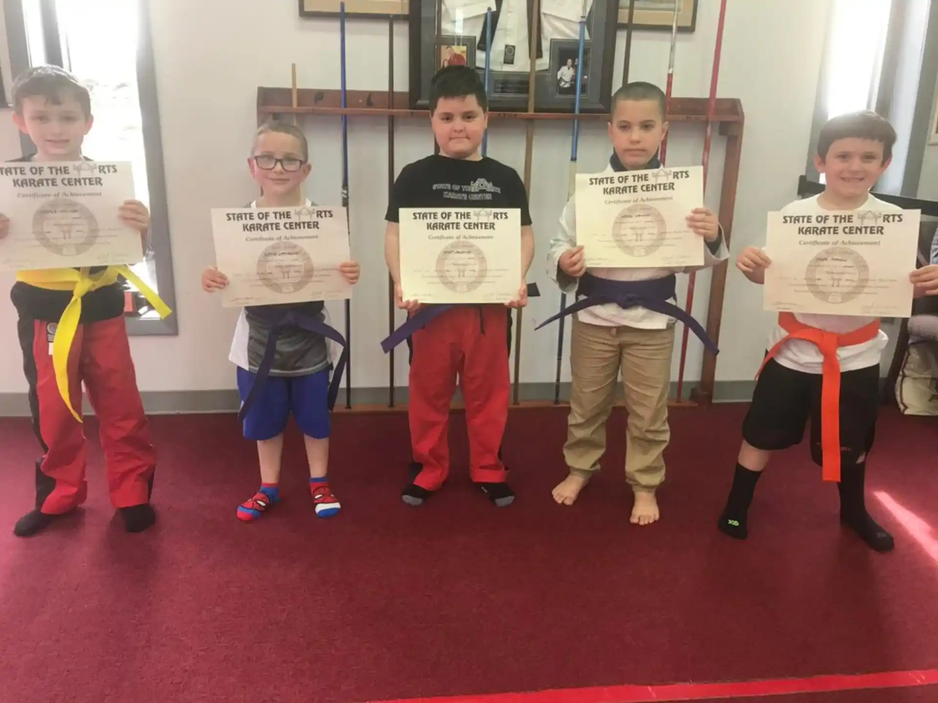 a group of kids holding signs