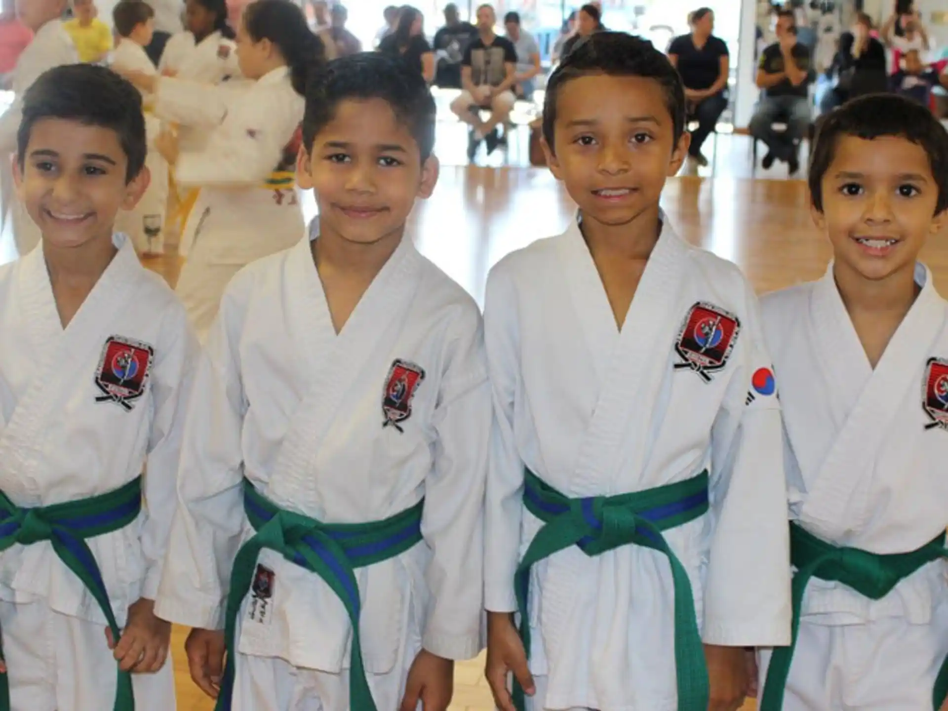 a group of girls in karate uniforms