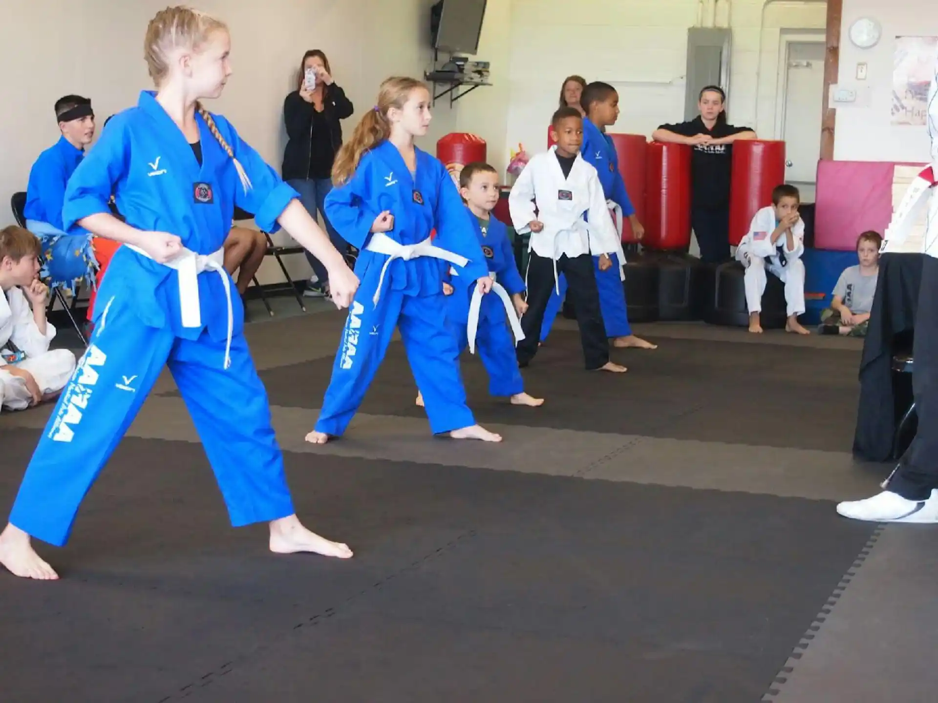 a group of people in karate uniforms