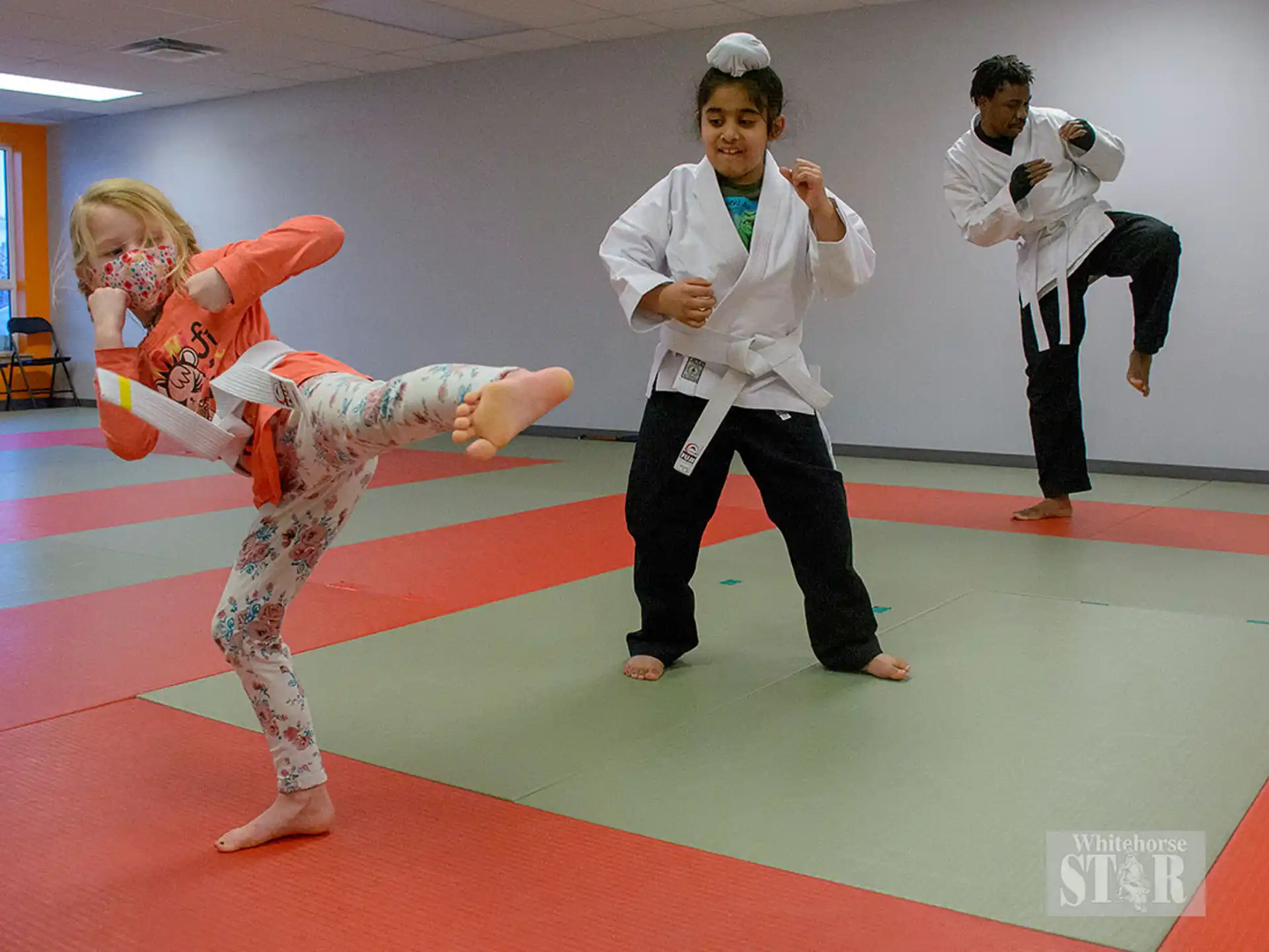 a group of people in martial arts uniforms