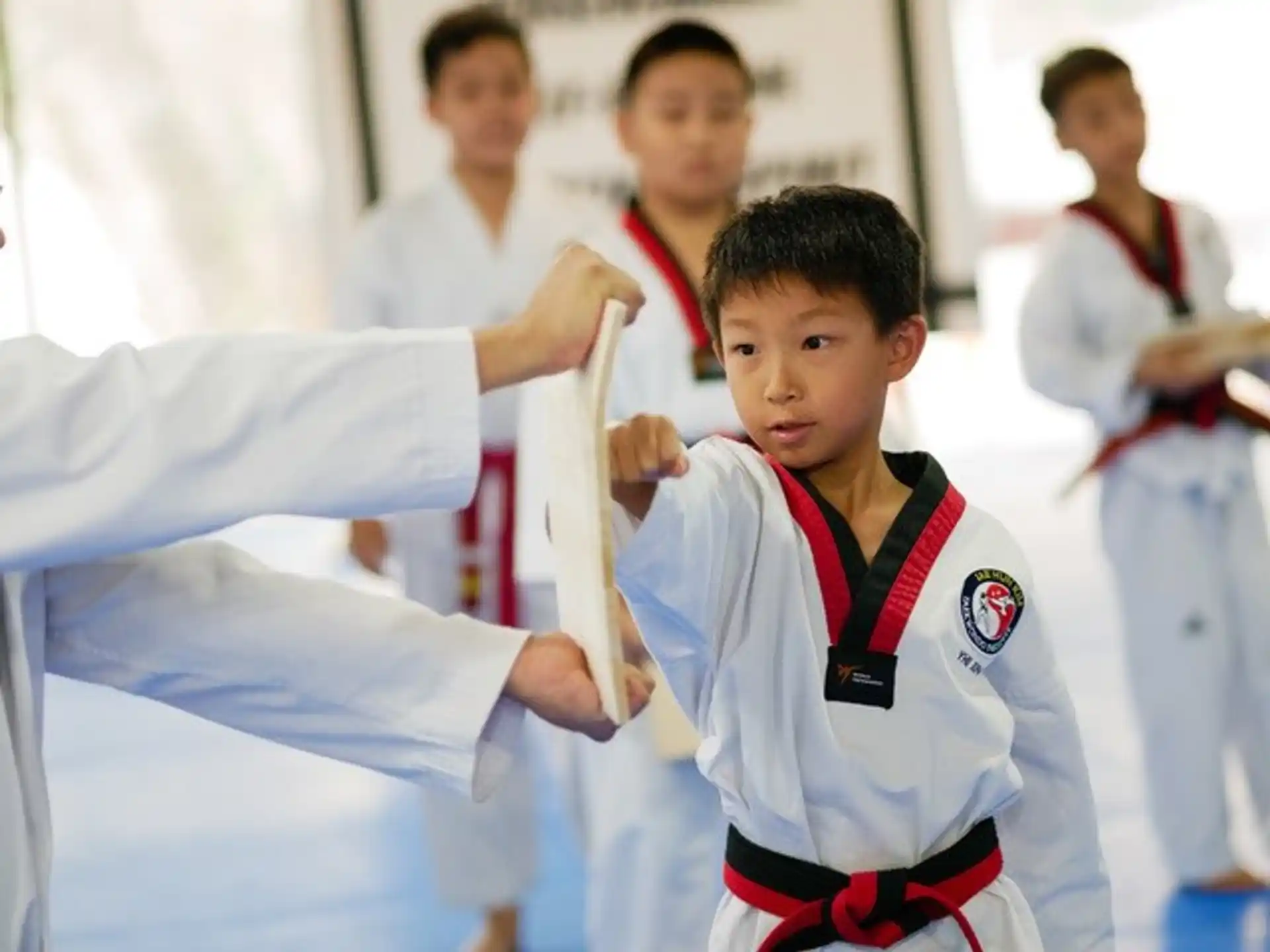 a boy in a karate uniform