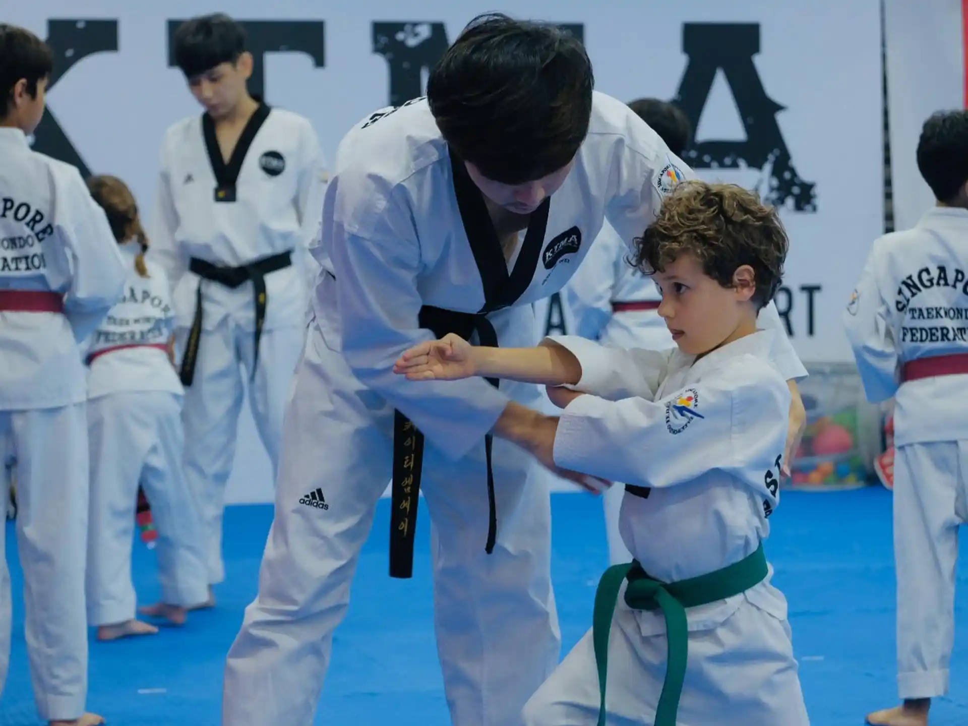 a group of people in karate uniforms