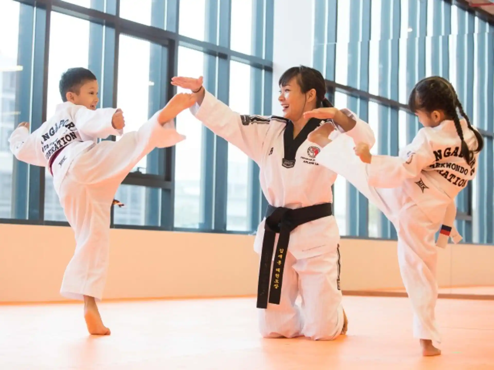 a group of people in karate uniforms