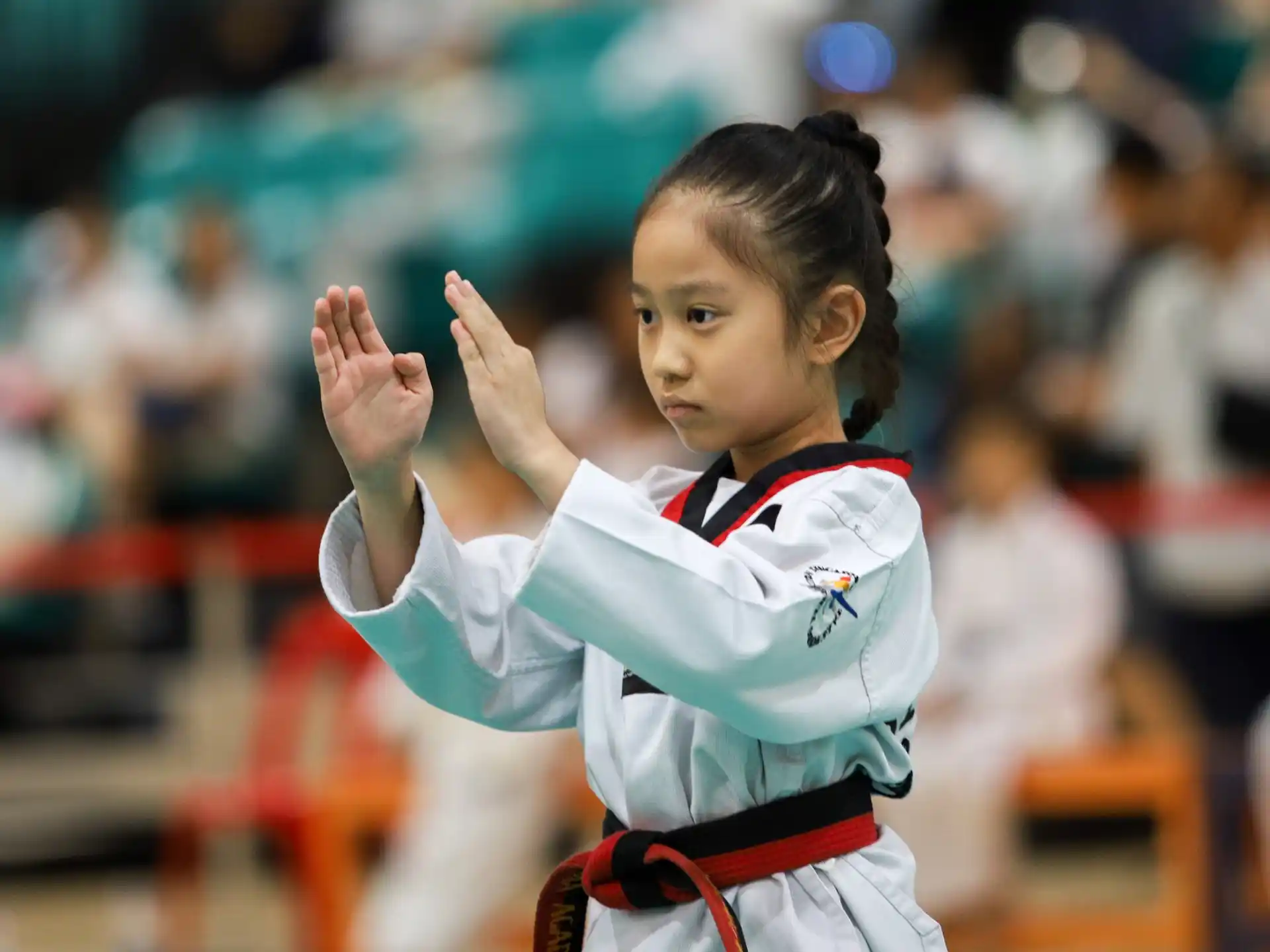 a young girl in a karate uniform